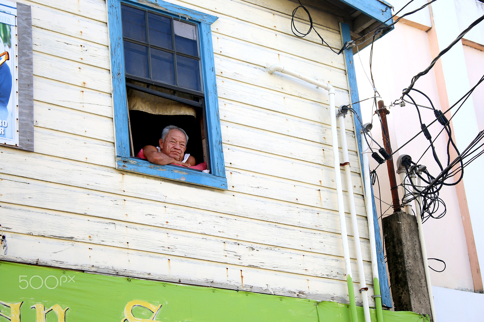 Canon EF-S 18-55mm F3.5-5.6 IS sample photo. Man in the window - belize photography