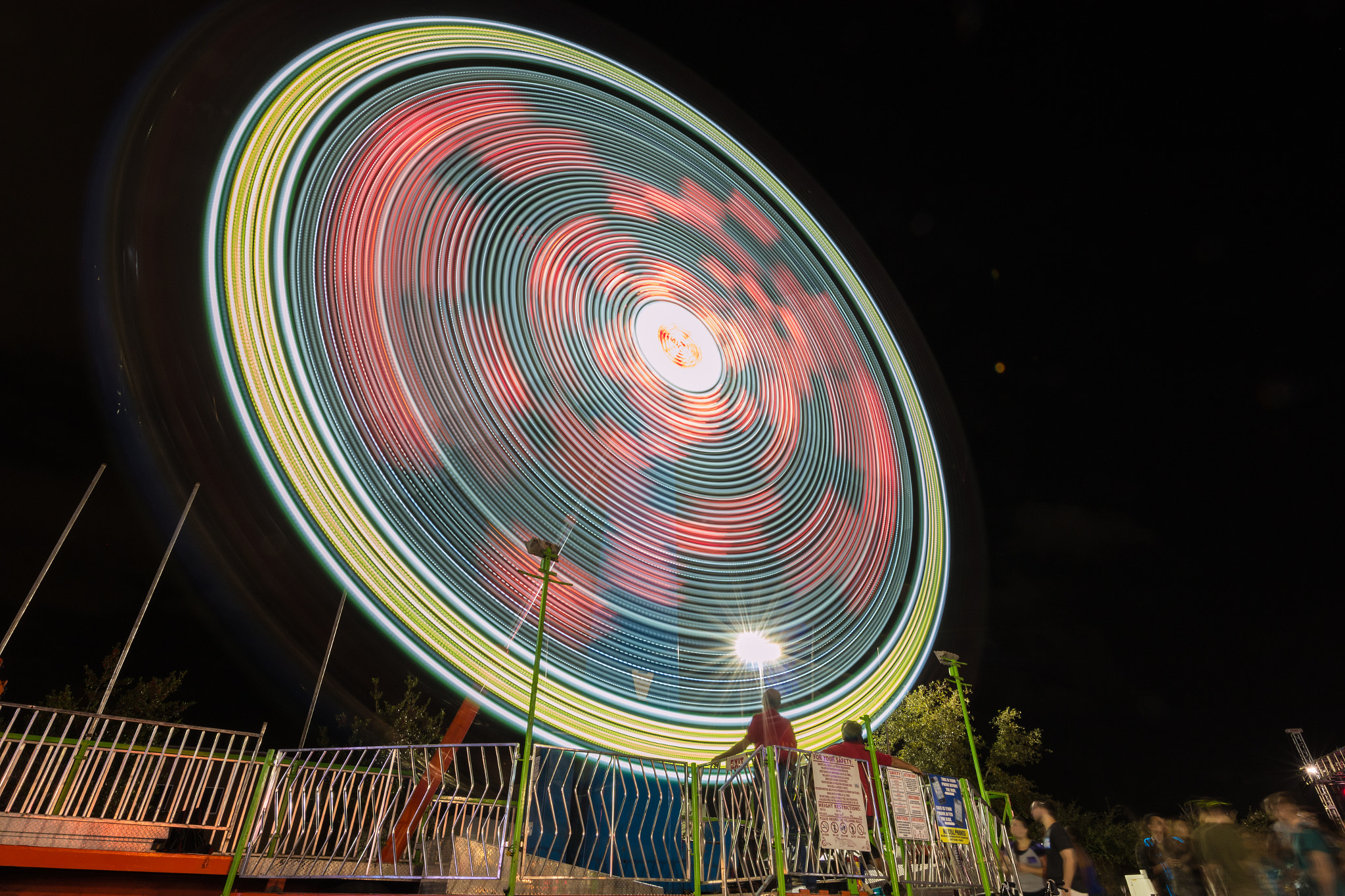Canon EOS 70D + Canon EF 11-24mm F4L USM sample photo. Spinning carnival ride photography
