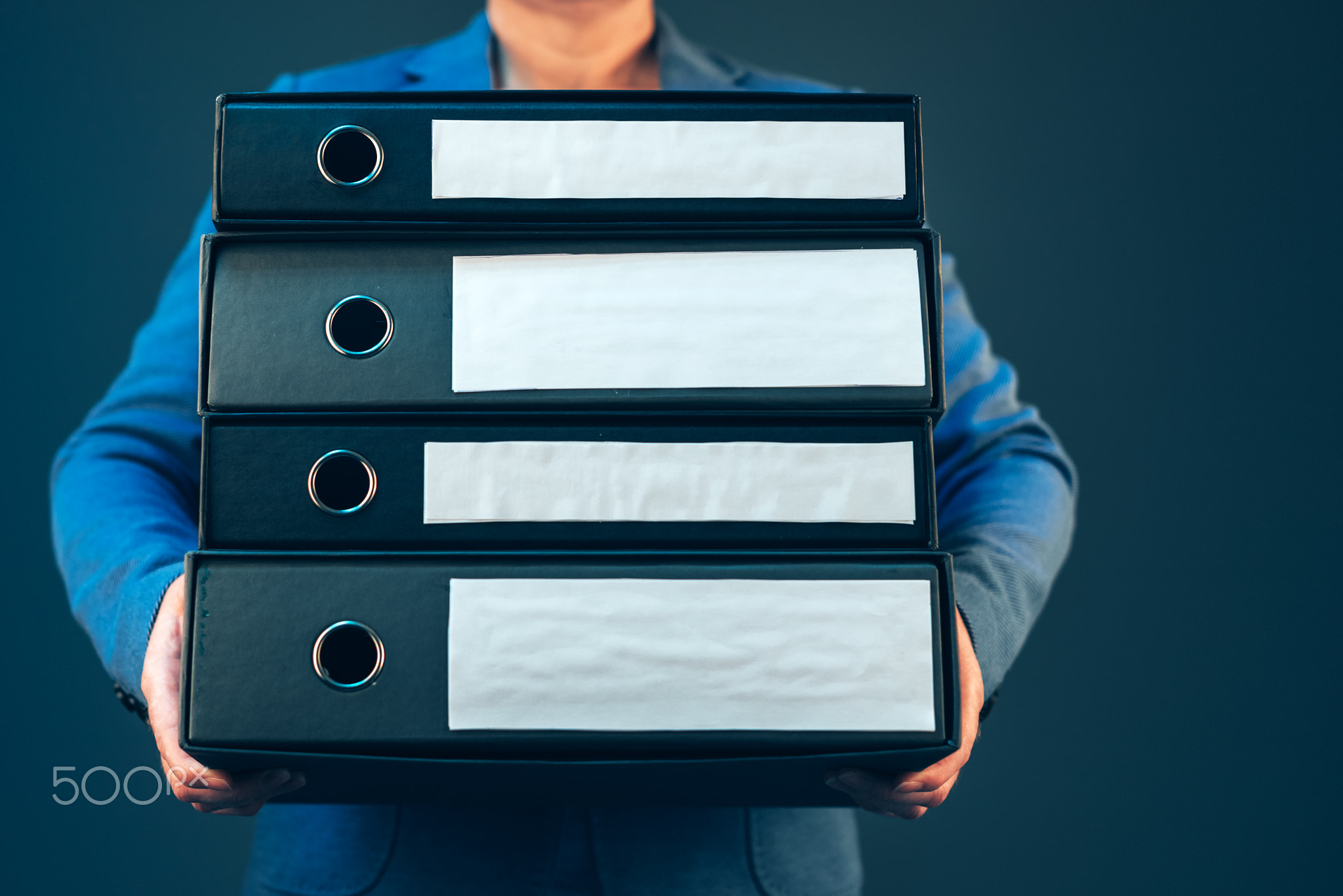 Business woman holding document binders