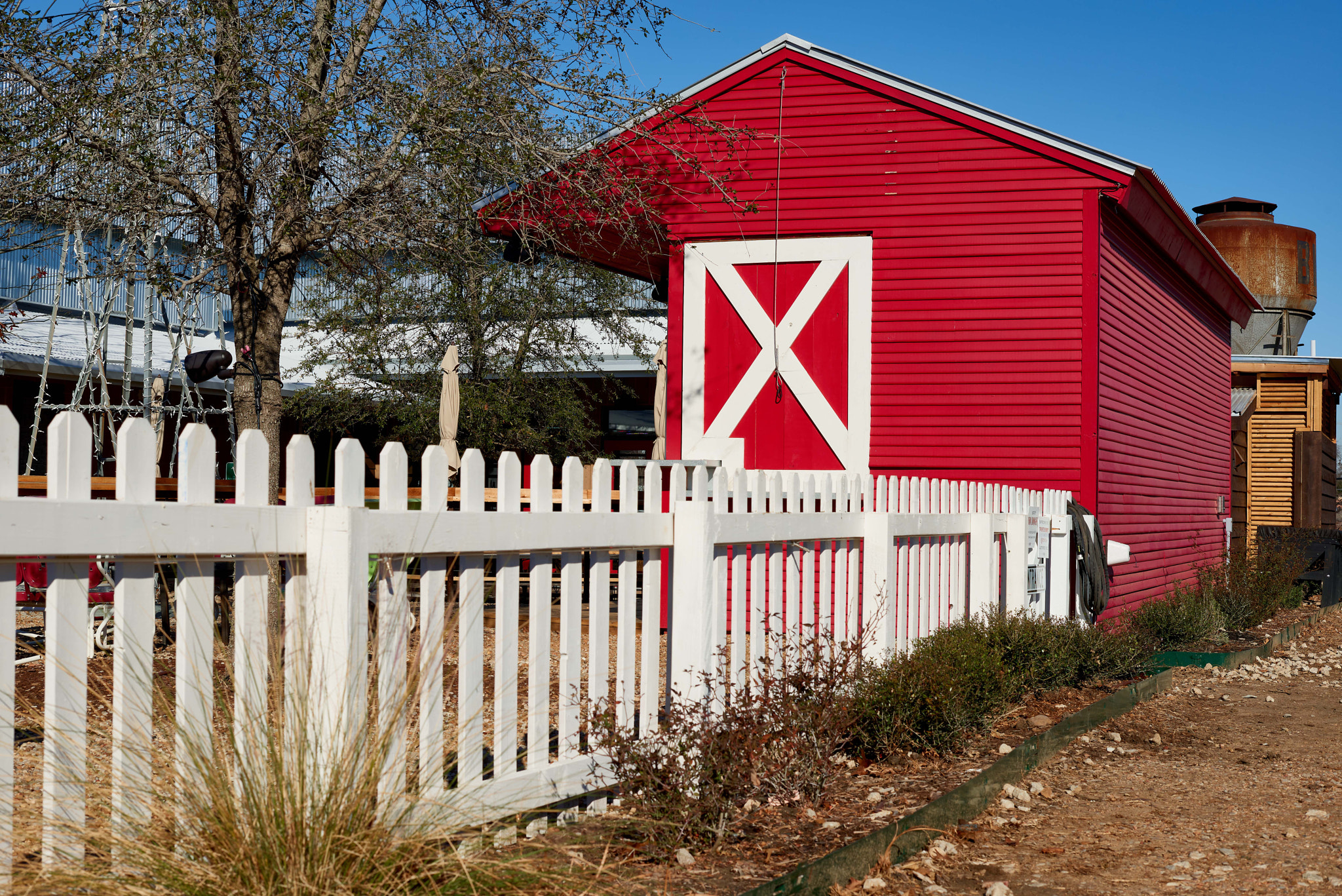 Nikon AF-S Nikkor 50mm F1.4G sample photo. Red barn and rustic water tank photography