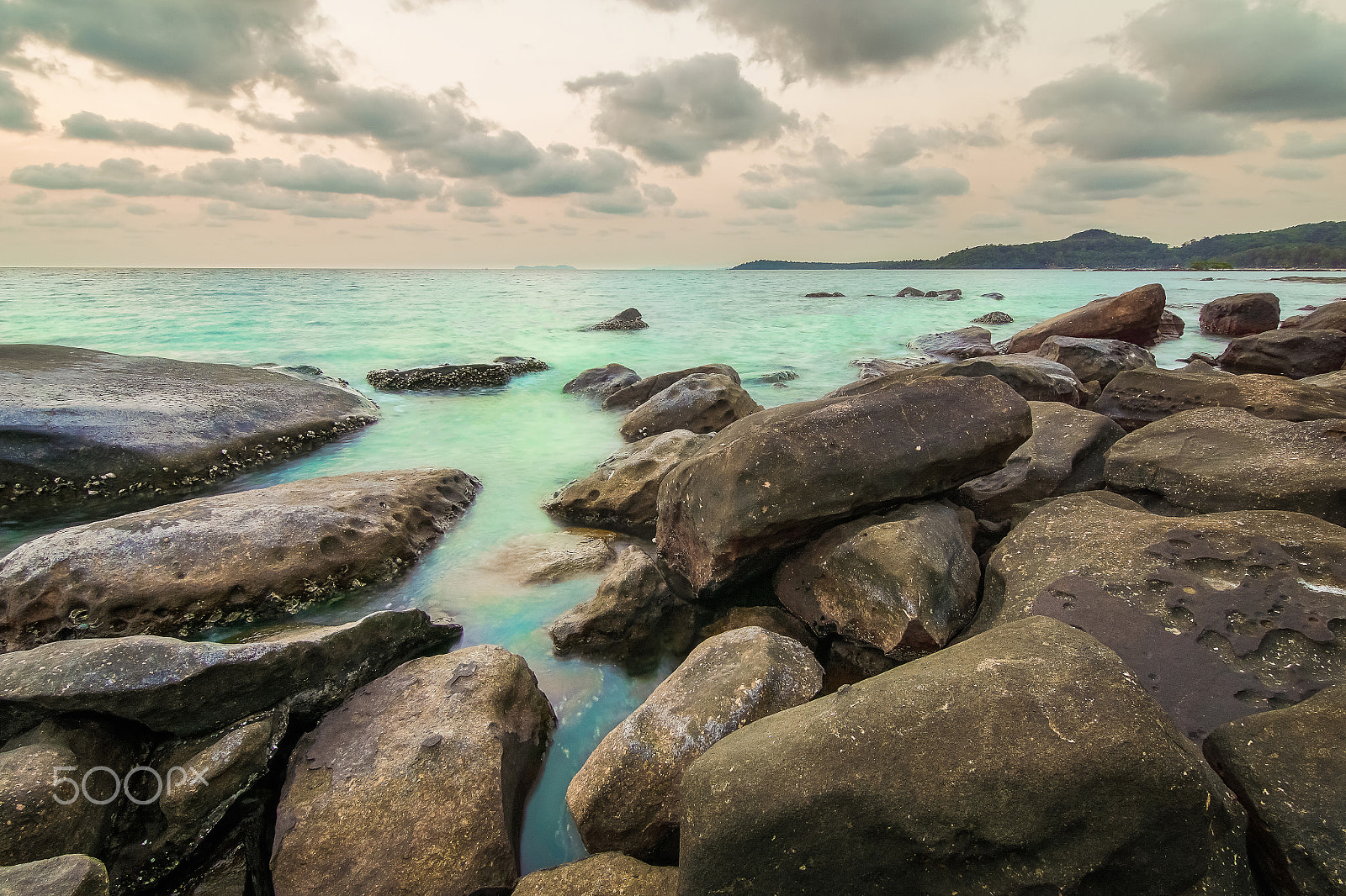 20mm F2.8 sample photo. Rock beach at small island and smoothe clouds photography
