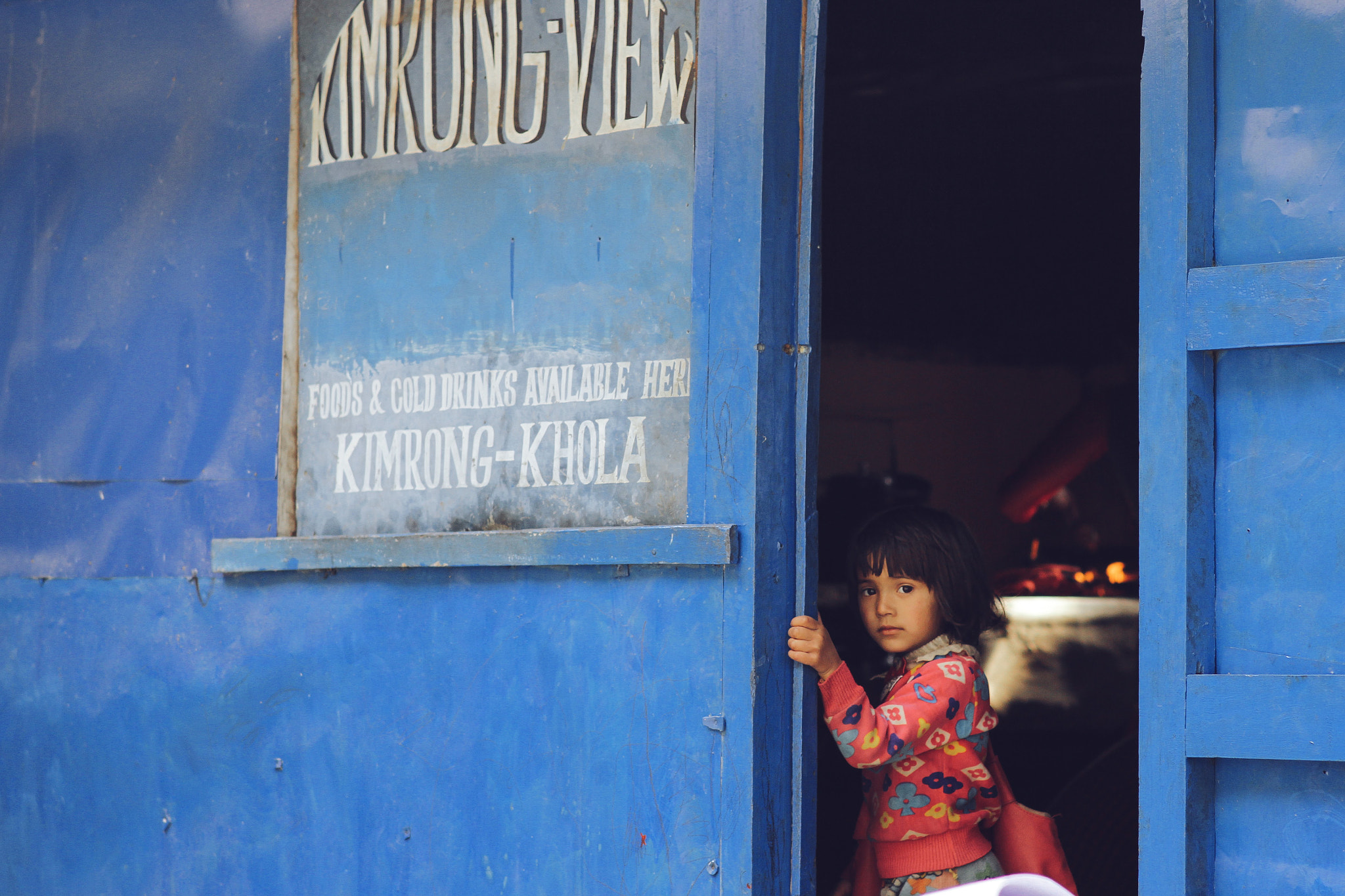Canon EF 35-80mm f/4-5.6 sample photo. Girl in the blue house photography