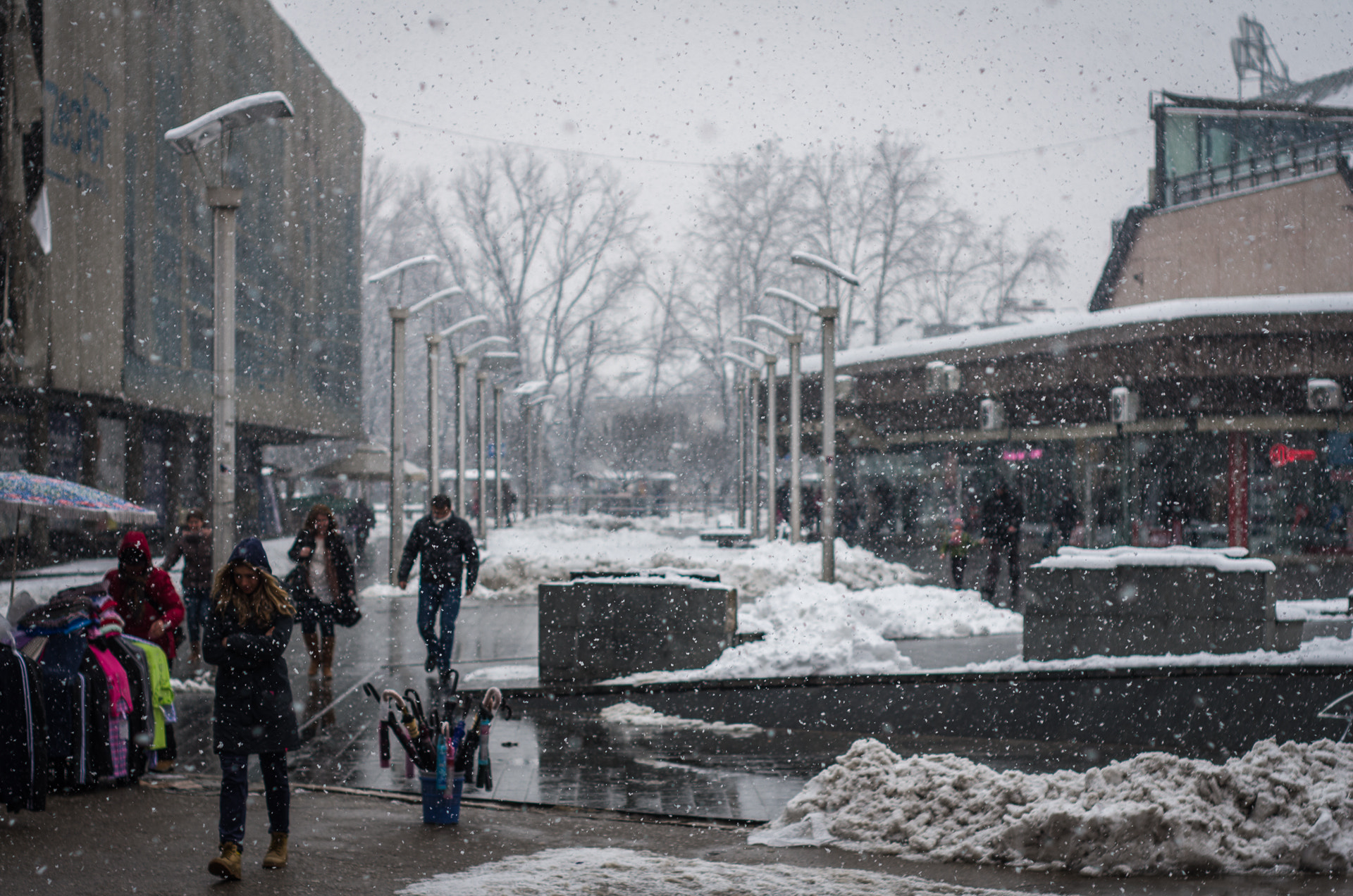 Pentax K-5 IIs + A Series Lens sample photo. People walking in the snow photography