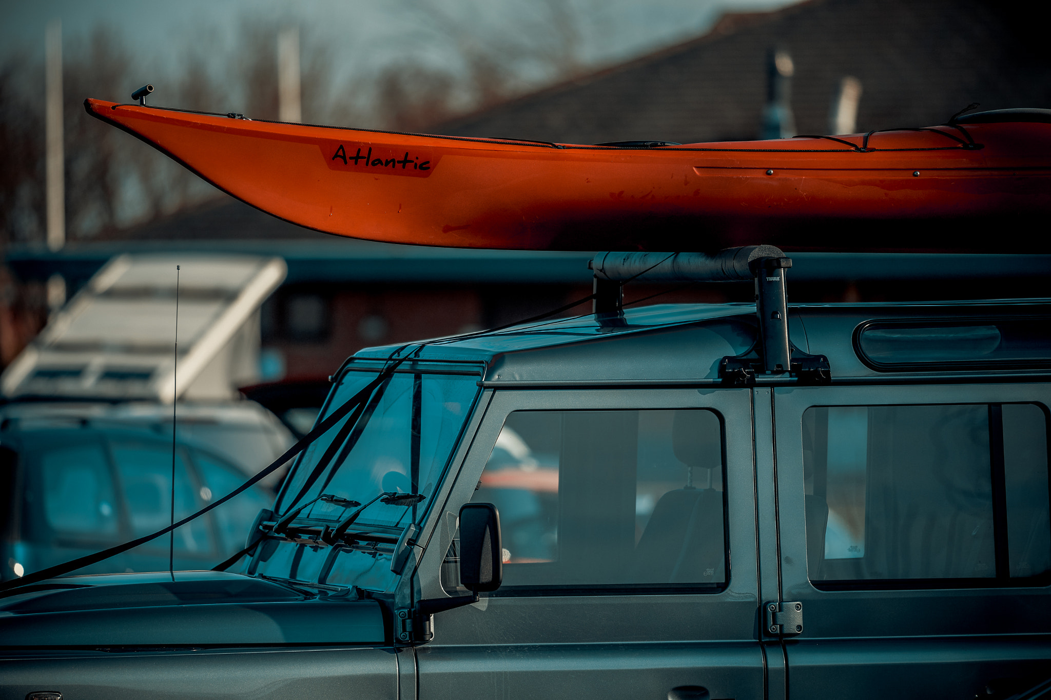 Nikon AF-S Nikkor 300mm f/4E PF ED VR sample photo. Kayak on land rover photography