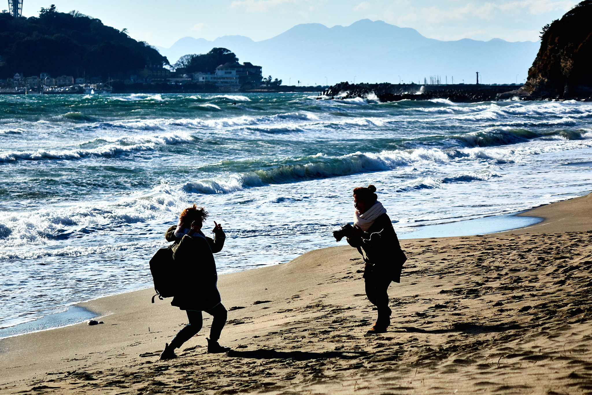 Sony Cyber-shot DSC-RX10 sample photo. Two person taking photo at the beach photography