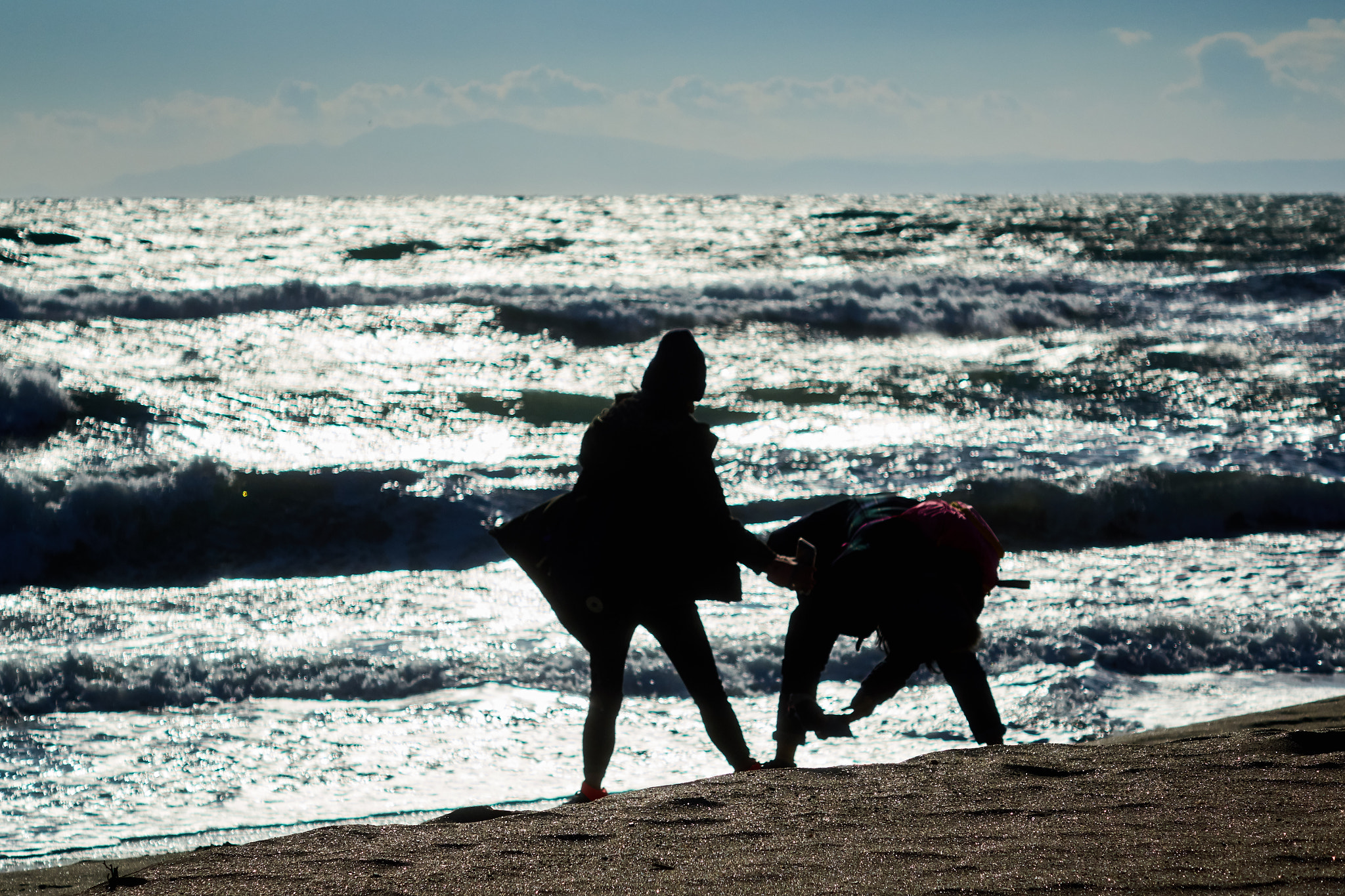 Sony Cyber-shot DSC-RX10 sample photo. Two person taking photo at the beach photography