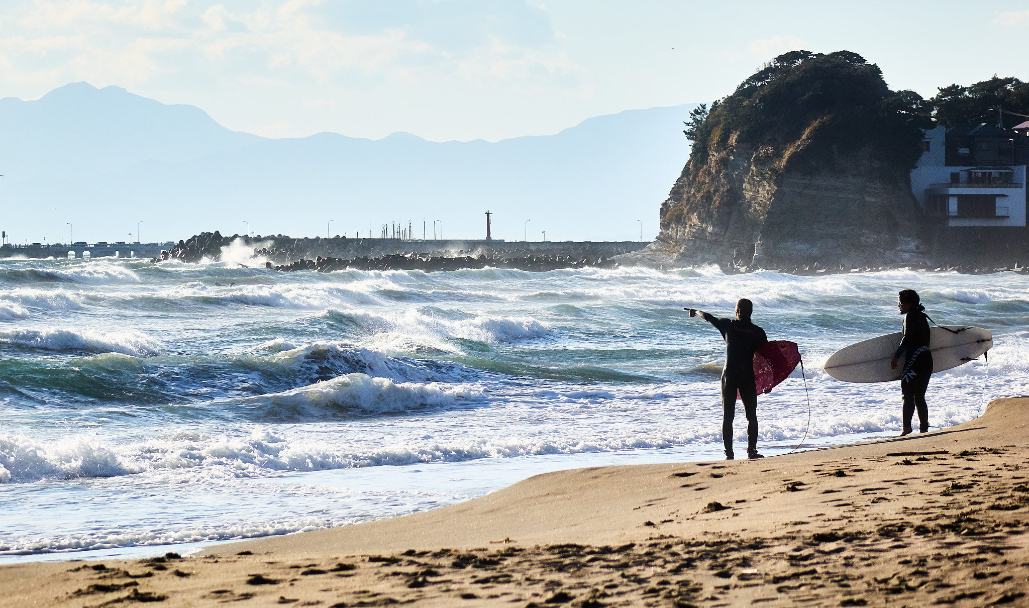 Sony Cyber-shot DSC-RX10 + Sony Cyber-shot DSC-RX10 sample photo. Surfers at windy beach photography