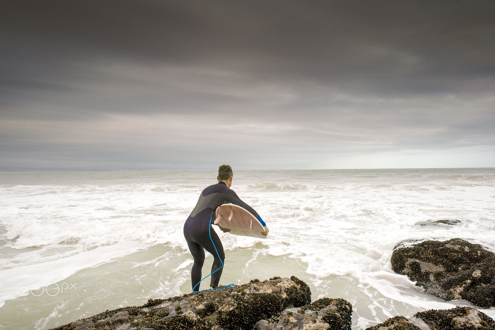 Nikon D600 + Nikon AF Nikkor 24mm F2.8D sample photo. Surfer leaping in to ocean photography