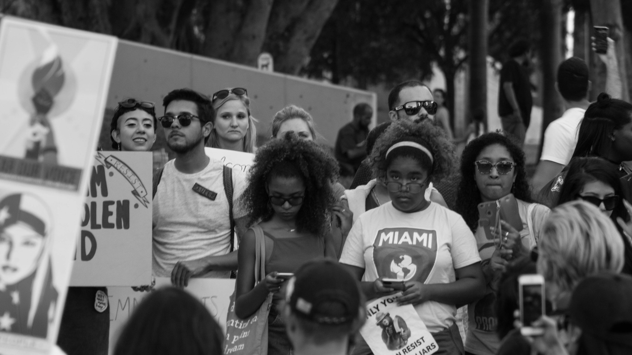 Canon EOS 650D (EOS Rebel T4i / EOS Kiss X6i) + EF75-300mm f/4-5.6 sample photo. Protestors look on as a young man speaks photography