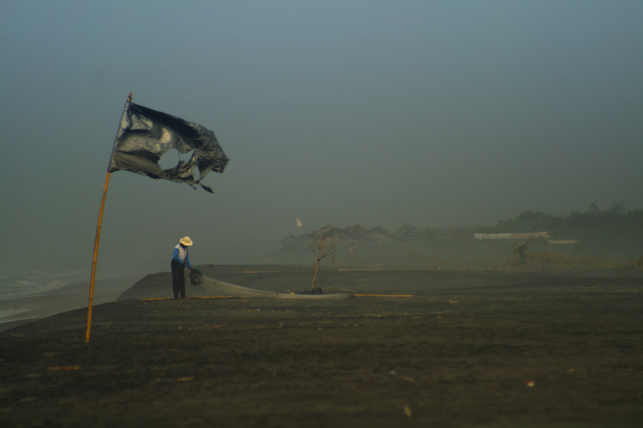 Canon EF 75-300mm f/4-5.6 USM sample photo. Local fisherman at the beach photography