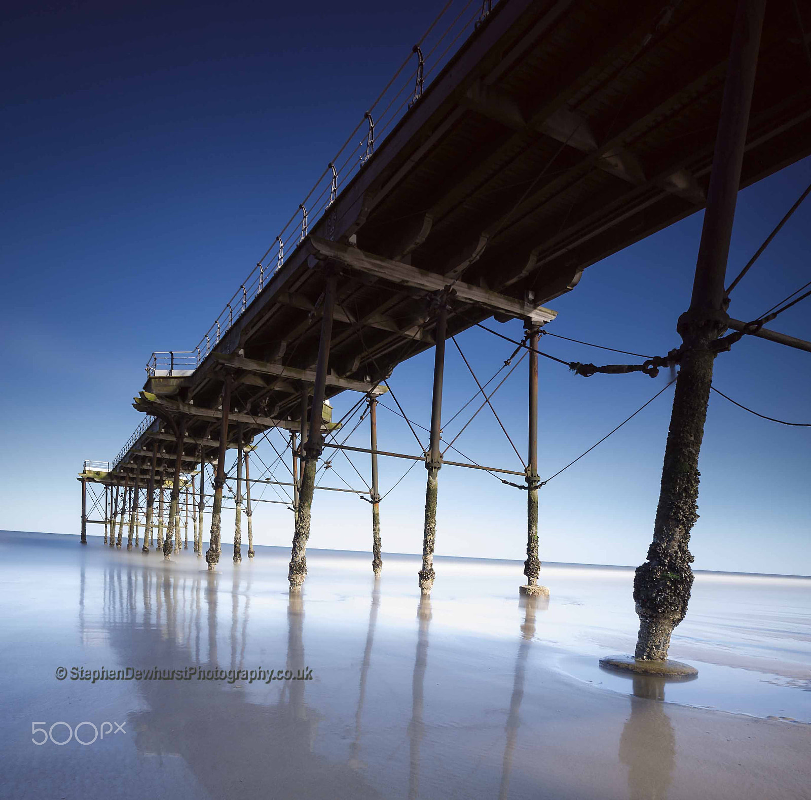 Nikon D3S sample photo. Saltburn pier leading into the sea with smooth water. photography