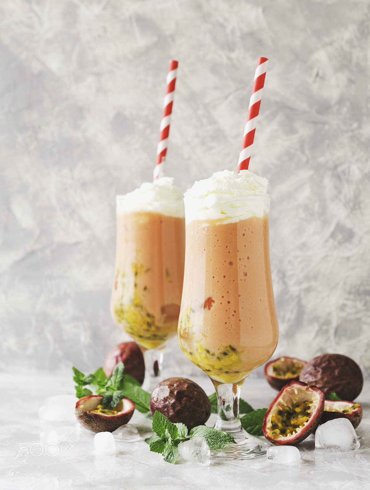 Nikon AF-S DX Micro Nikkor 40mm F2.8 sample photo. Pink milkshake with ice cubes and mint leaves and fruits of passion fruit on a marble table,... photography