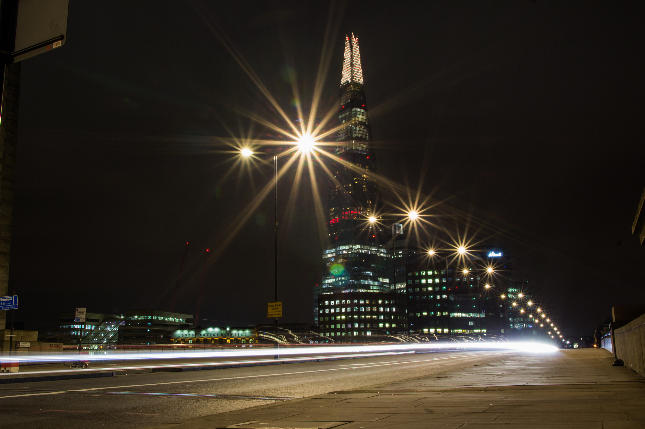 Canon EF-S 17-55mm F2.8 IS USM sample photo. The shard looms behind london traffic photography