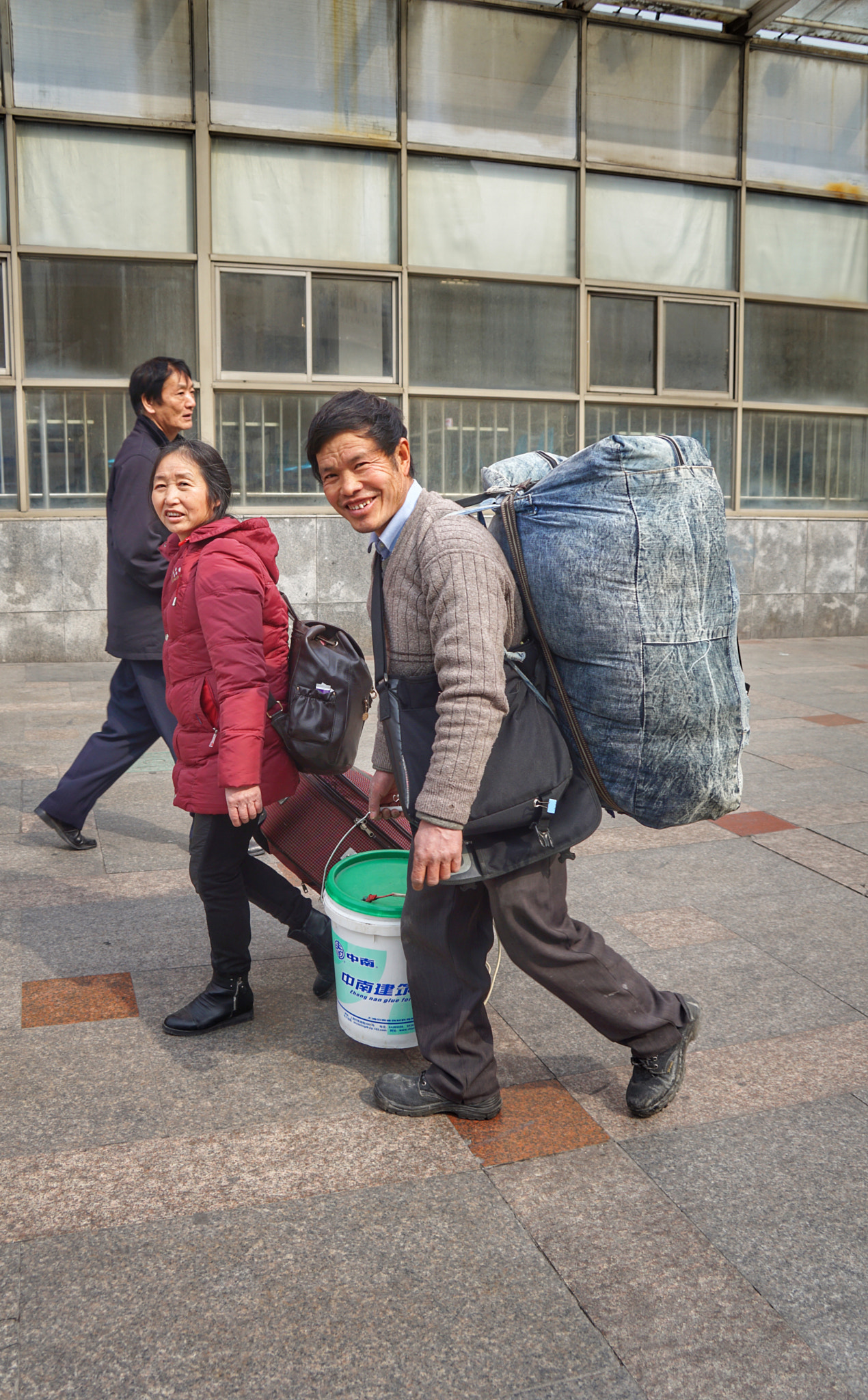 Sony E 18-200mm F3.5-6.3 OSS sample photo. Approaching the railway station to go home for chinese new year photography