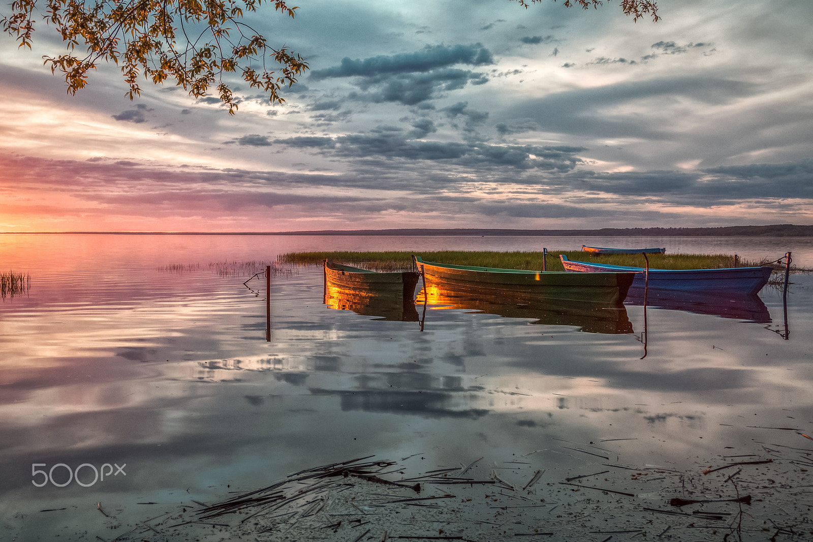 Canon EF 28-135mm F3.5-5.6 IS USM sample photo. Wooden boats at sunset photography