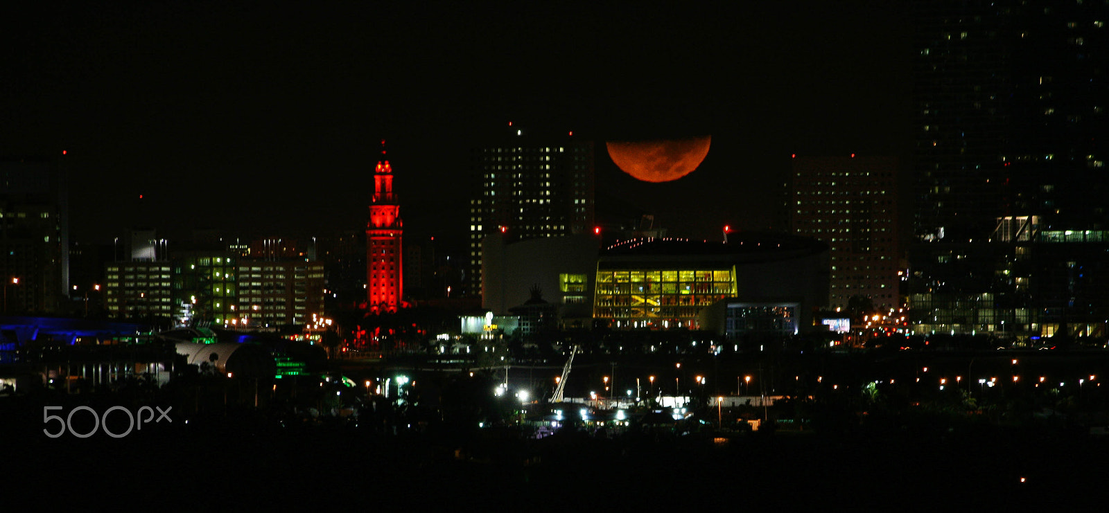 Canon EF-S 55-250mm F4-5.6 IS sample photo. Moon over aa arena photography
