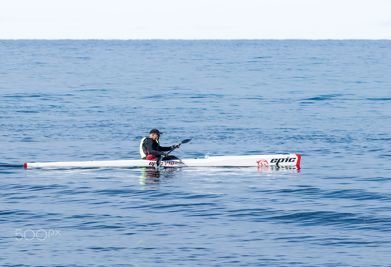 Canon EOS 80D + Sigma 50-200mm F4-5.6 DC OS HSM sample photo. Athlete training on kayak winter morning on sea near coast photography