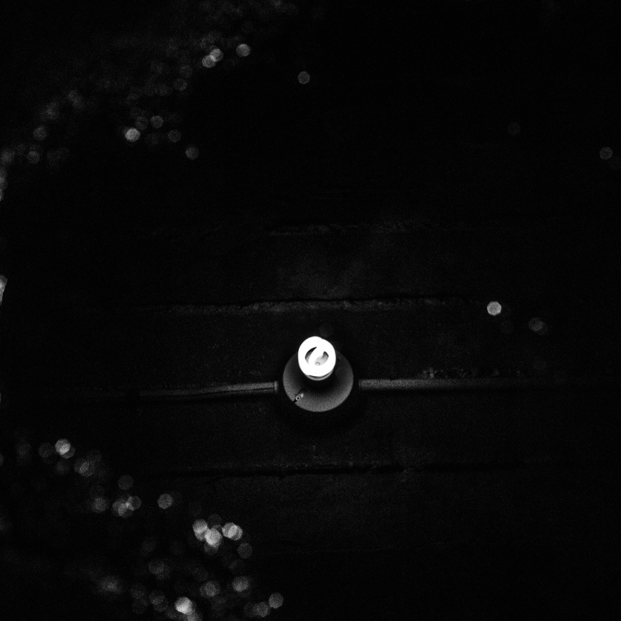 Nikon D60 + Nikon AF Nikkor 50mm F1.8D sample photo. Reflection of a lightbulb in water photography