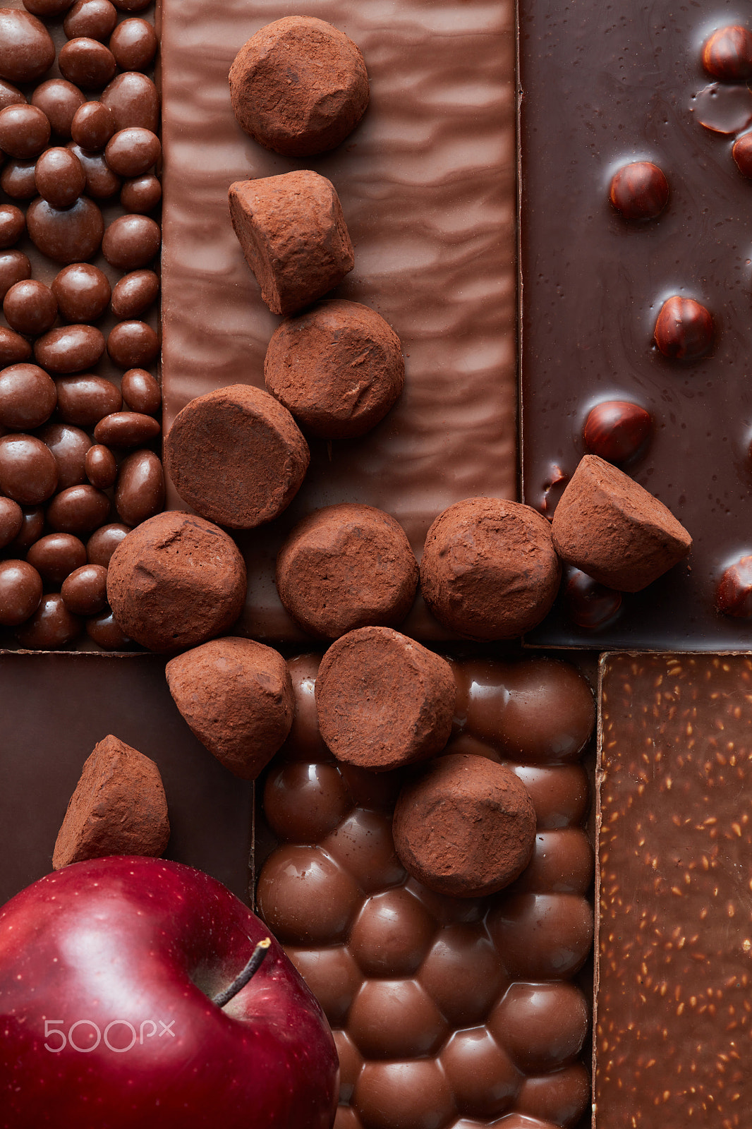 Canon EF 100mm F2.8 Macro USM sample photo. Red apple and truffle candies on the background photography