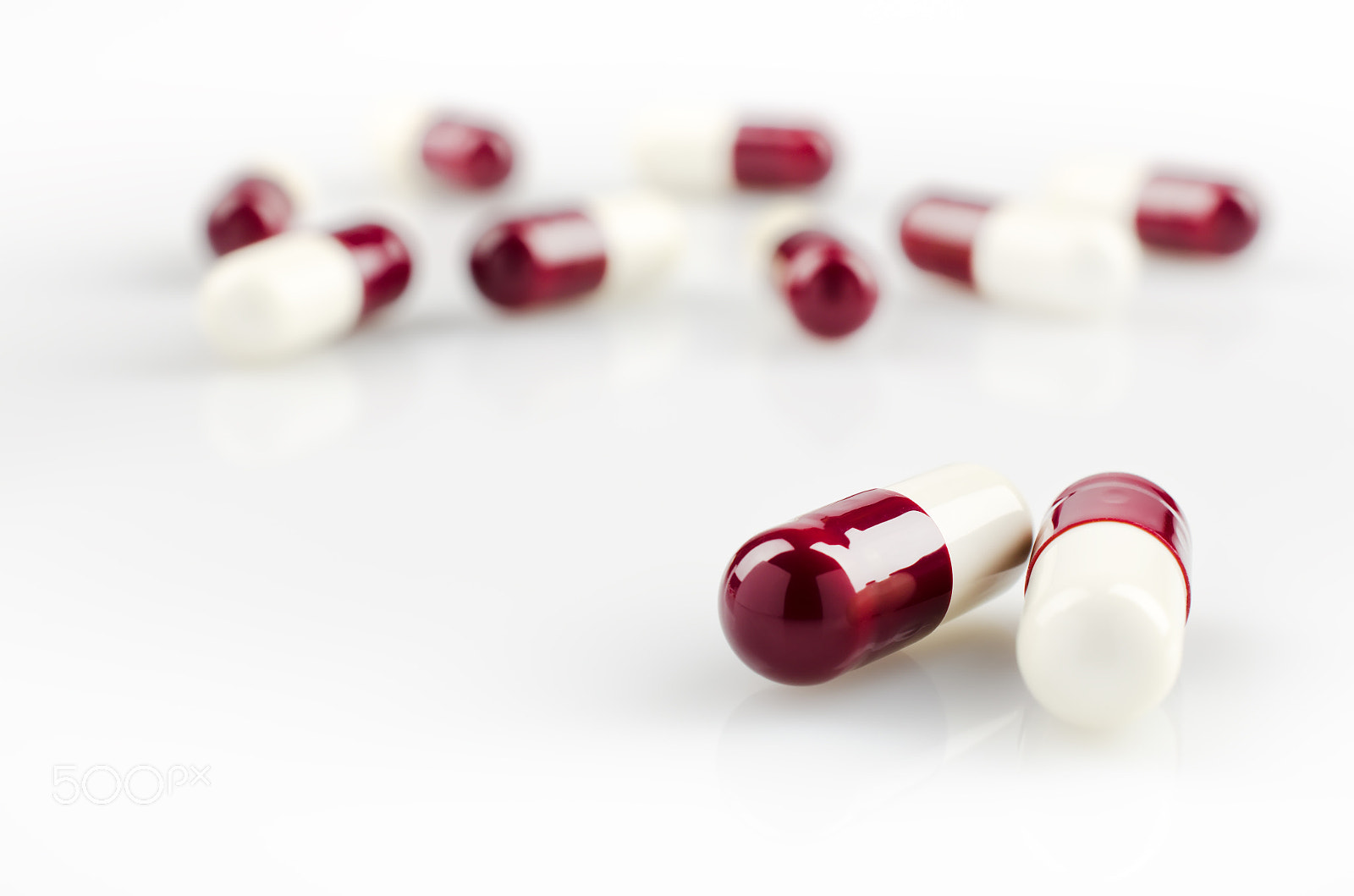 Nikon AF-S DX Micro Nikkor 40mm F2.8 sample photo. Dark red medical capsules photography