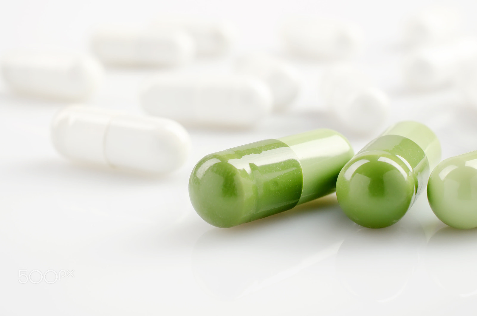Nikon AF-S DX Micro Nikkor 40mm F2.8 sample photo. Green and white capsules photography