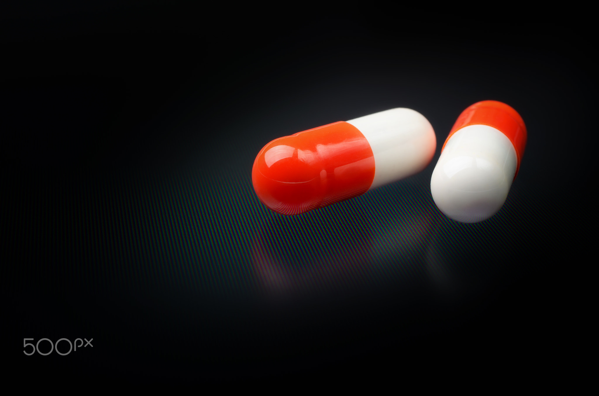 White and red medicine antibiotic pills