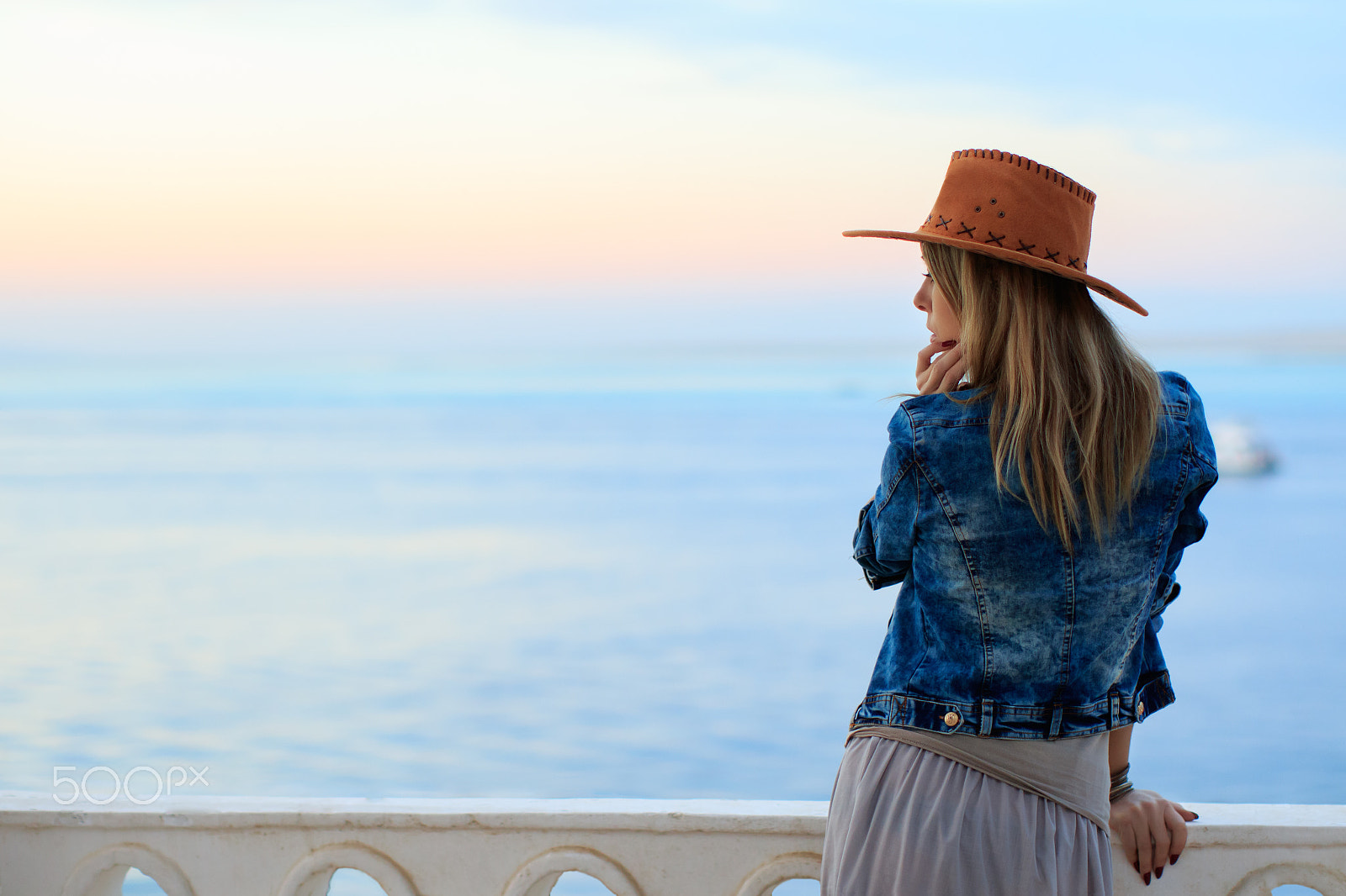 Canon EF 50mm F1.2L USM sample photo. Woman in cowboy wild west style, sunset sea view photography