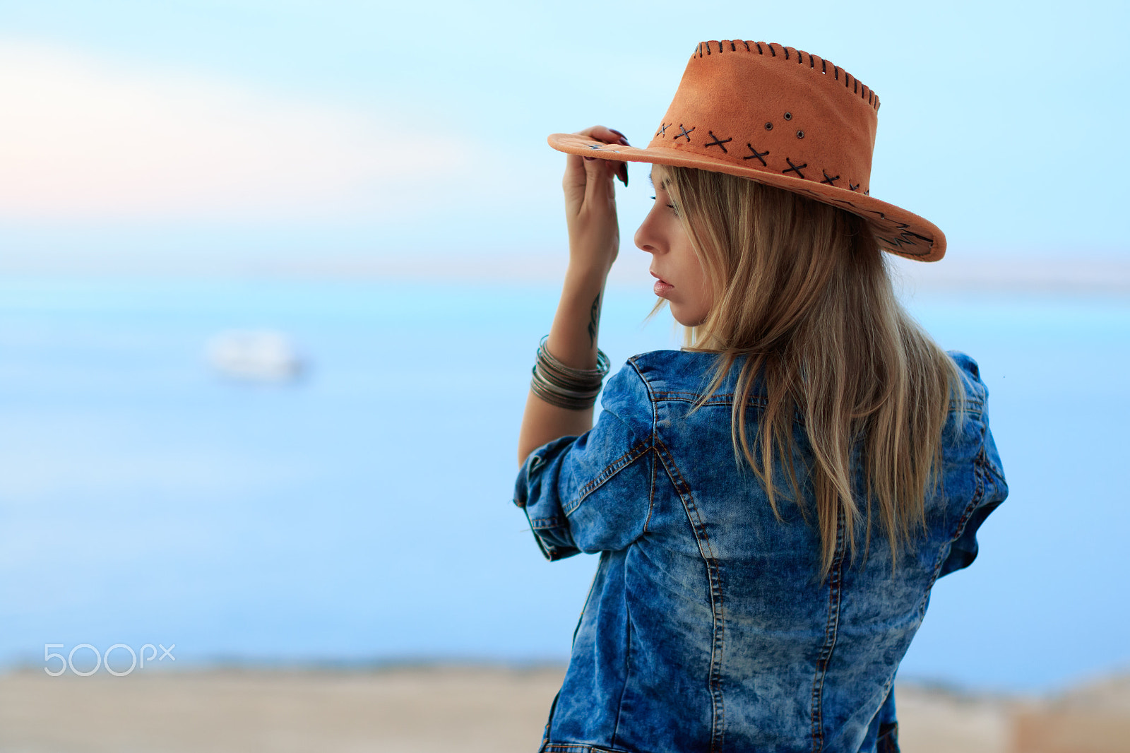 Canon EF 50mm F1.2L USM sample photo. Woman in cowboy wild west style, sunset sea view photography