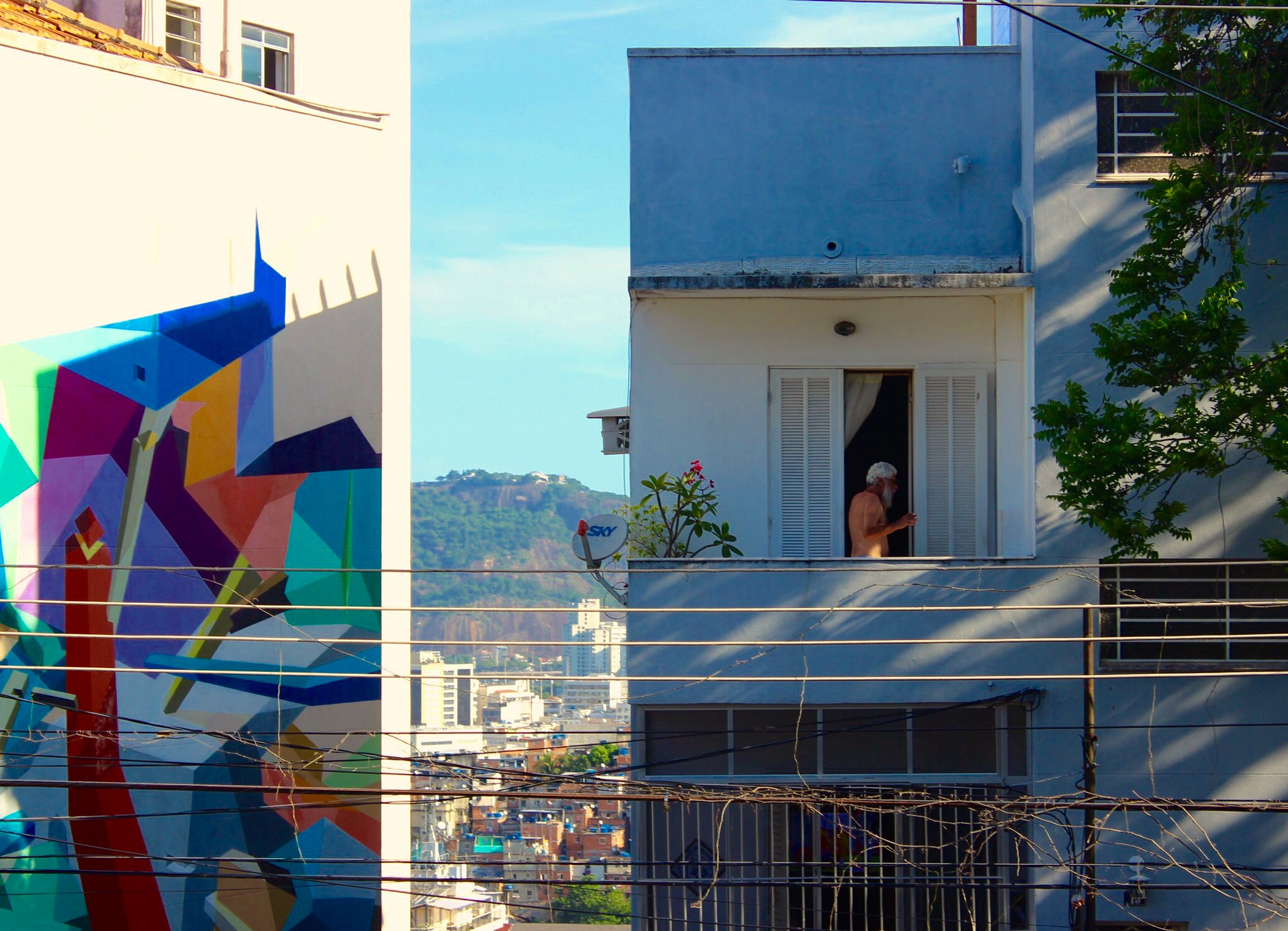 Canon EF-S 18-55mm F3.5-5.6 IS II sample photo. Man appreciating the view from his balcony at santa teresa, rio de janeiro. photography