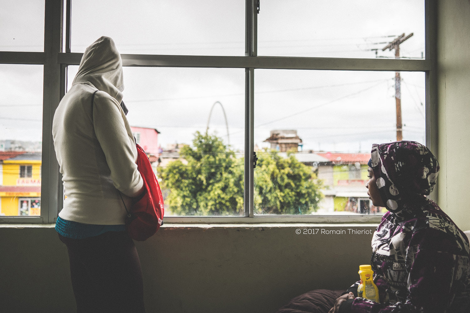 35mm F2.0 sample photo. Haitian women in a refugee place photography