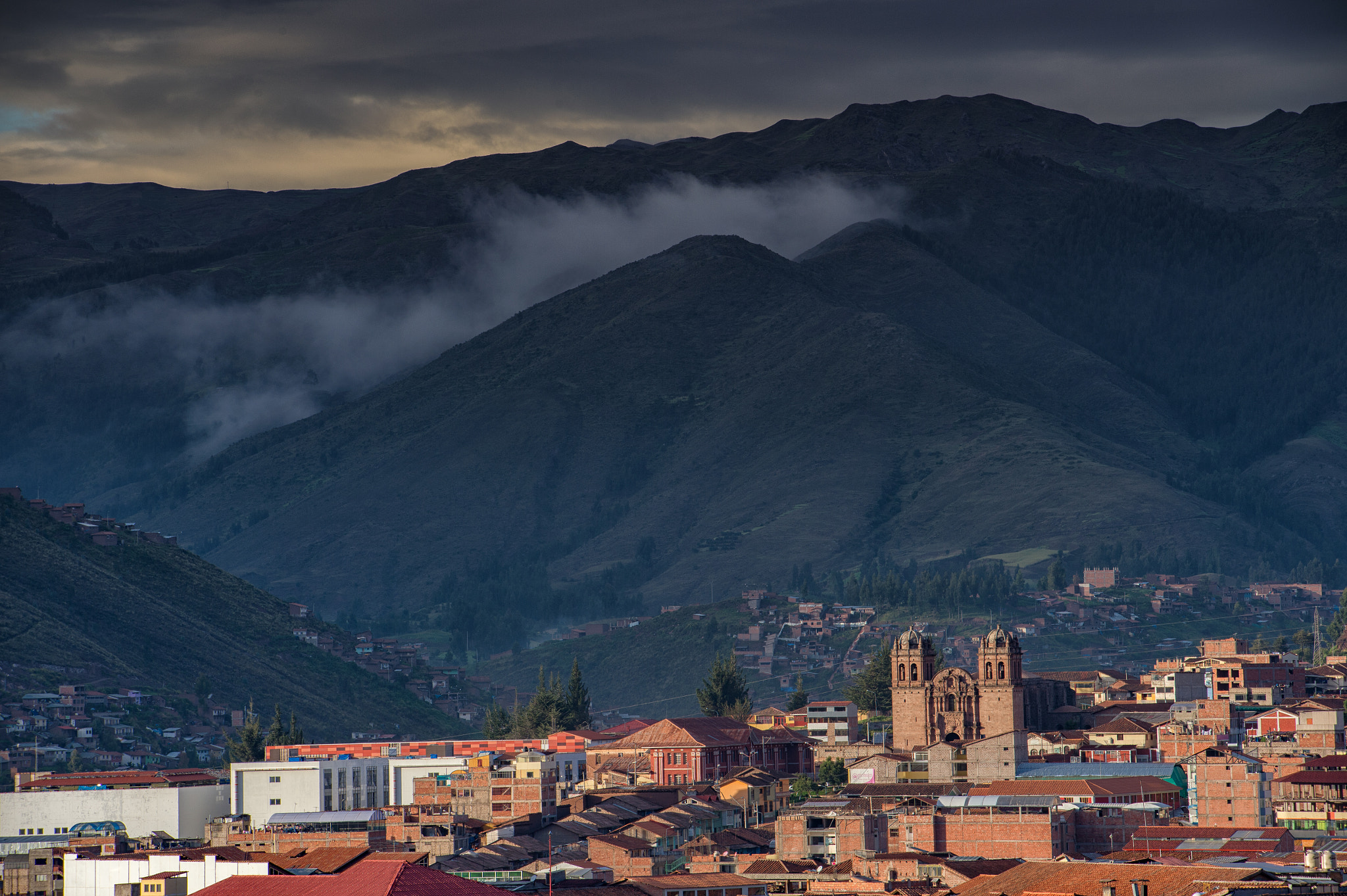 Nikon D4S sample photo. Hi contrast of moutain un lighgt shading with cusco city view, peru photography