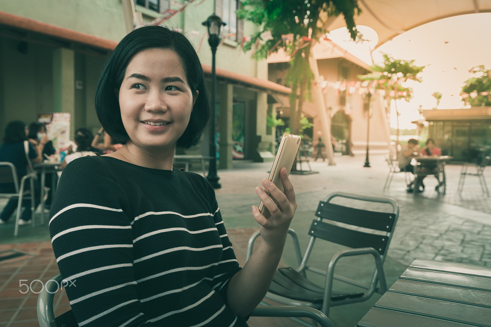 Nikon AF-S Nikkor 18-35mm F3.5-4.5G ED sample photo. Asian woman using mobile phone photography