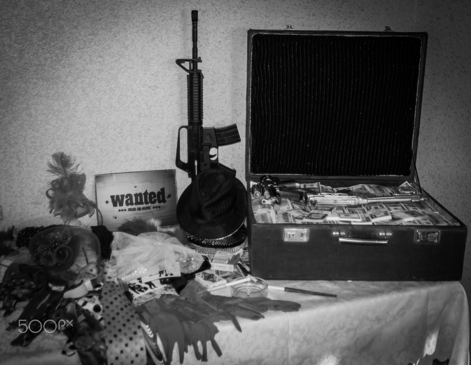Nikon D3000 sample photo. Suitcase money and gun photography