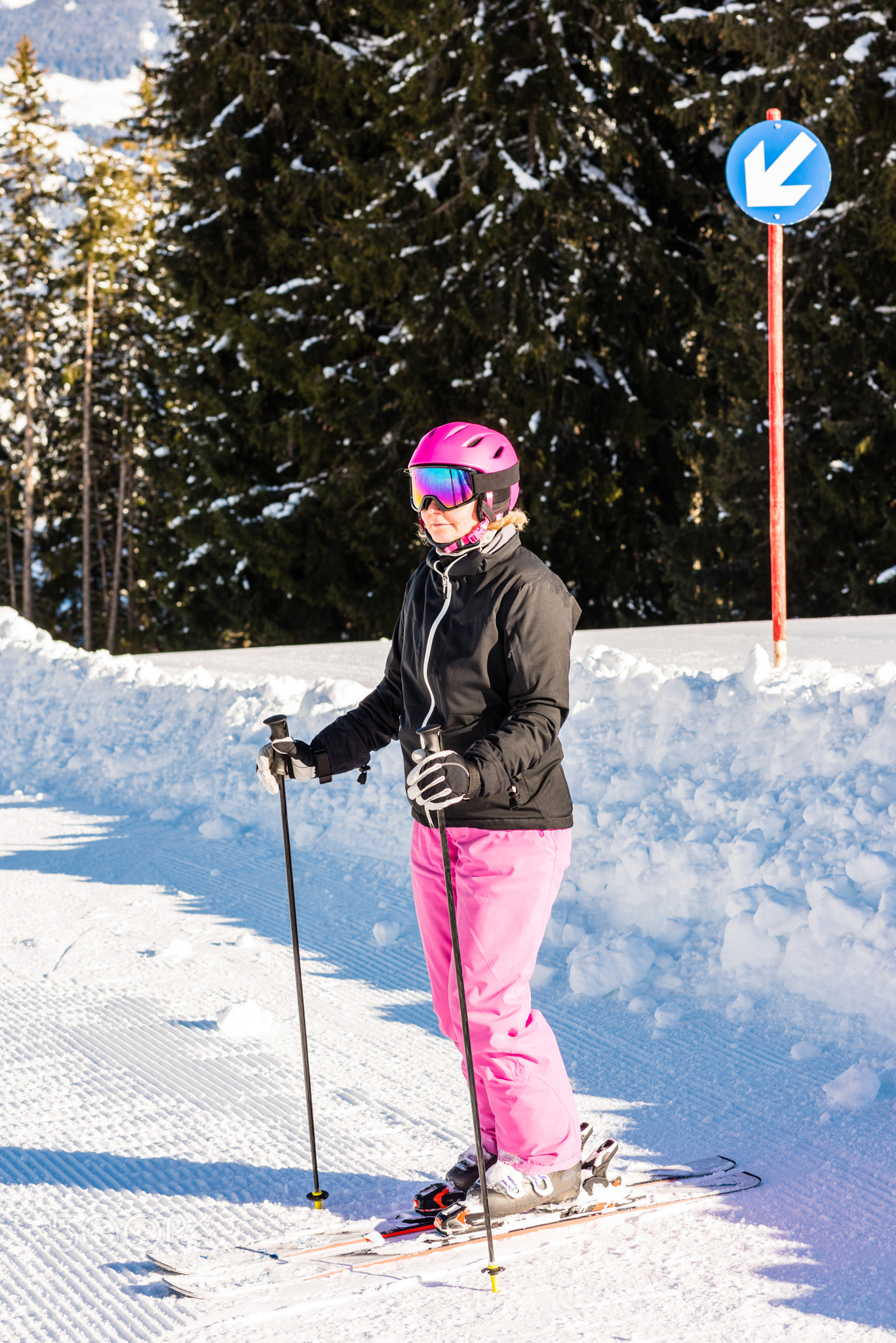 attractive middle aged woman with ski and snow