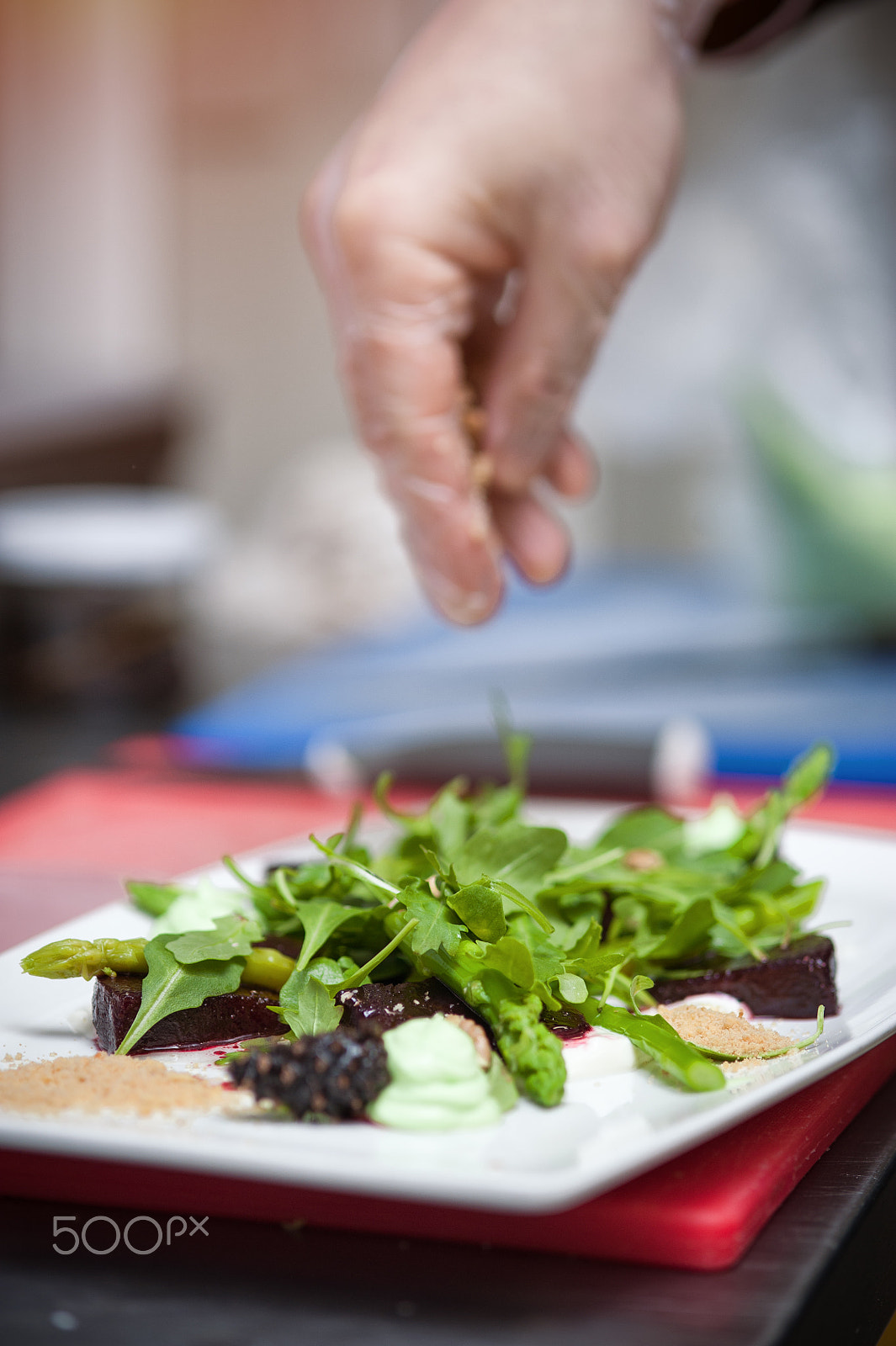 Nikon D700 + AF Micro-Nikkor 105mm f/2.8 sample photo. Male chef cooking salad with arugula and beet photography