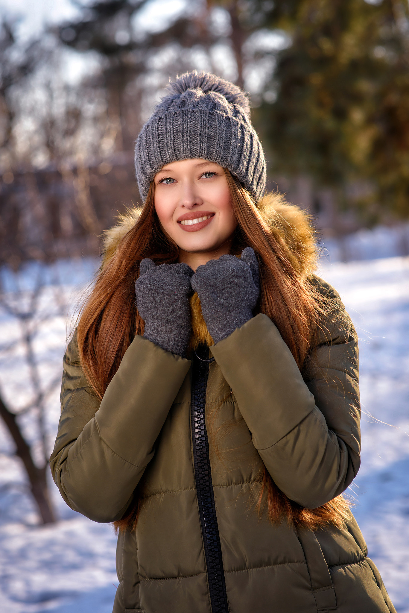 Nikon D810 + Sigma 85mm F1.4 EX DG HSM sample photo. Young attractive woman dressed up warm in coat, hat and gloves, enjoying winter sun and smiling photography