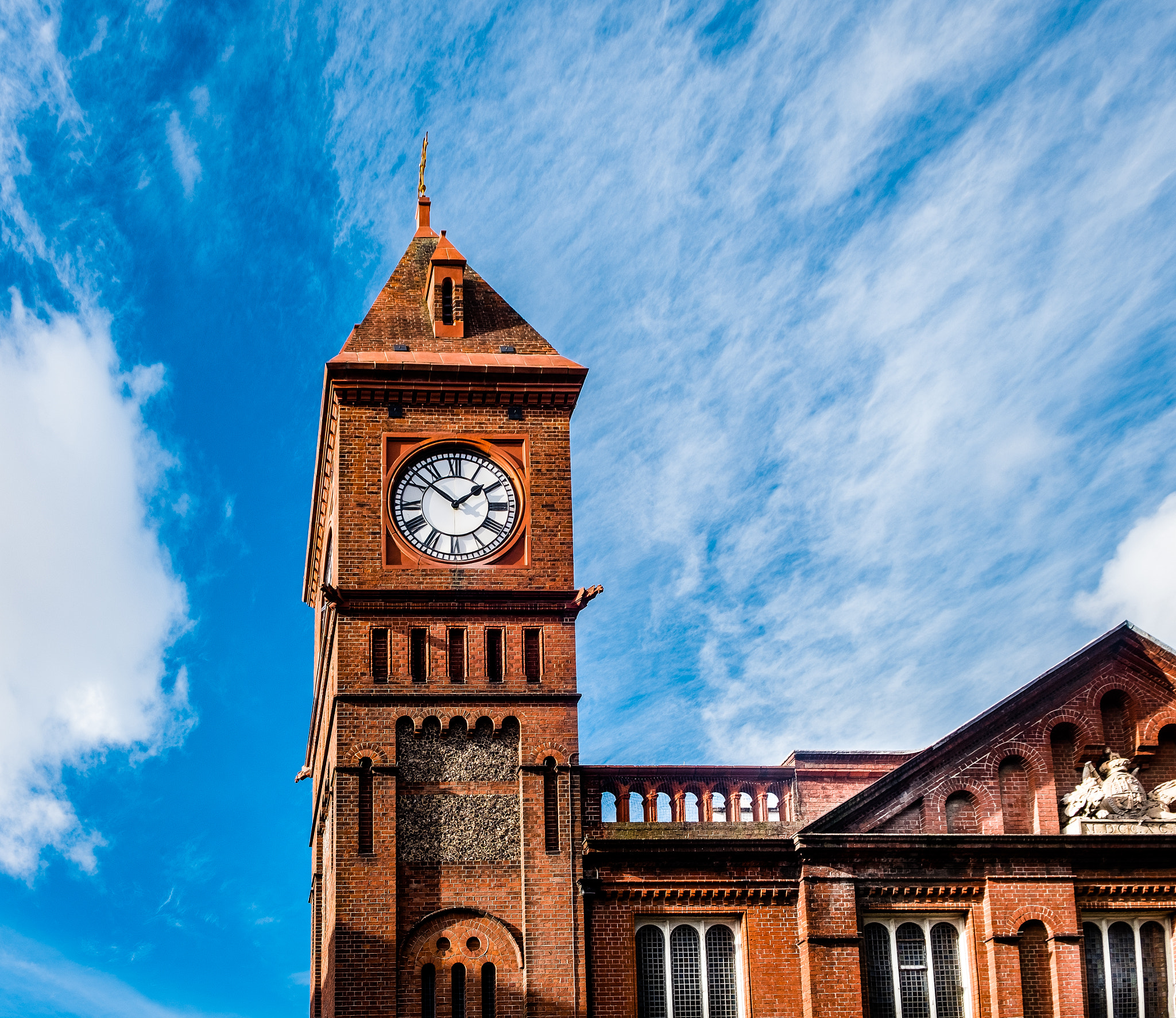 Fujifilm X-Pro2 + Fujifilm XF 18-55mm F2.8-4 R LM OIS sample photo. Sun hitting the clock over the church photography