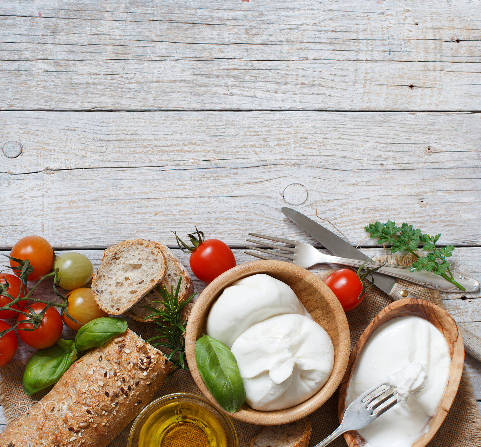 Canon EOS 650D (EOS Rebel T4i / EOS Kiss X6i) + Canon EF 50mm F1.2L USM sample photo. Italian cheese burrata with bread, vegetables and herbs photography