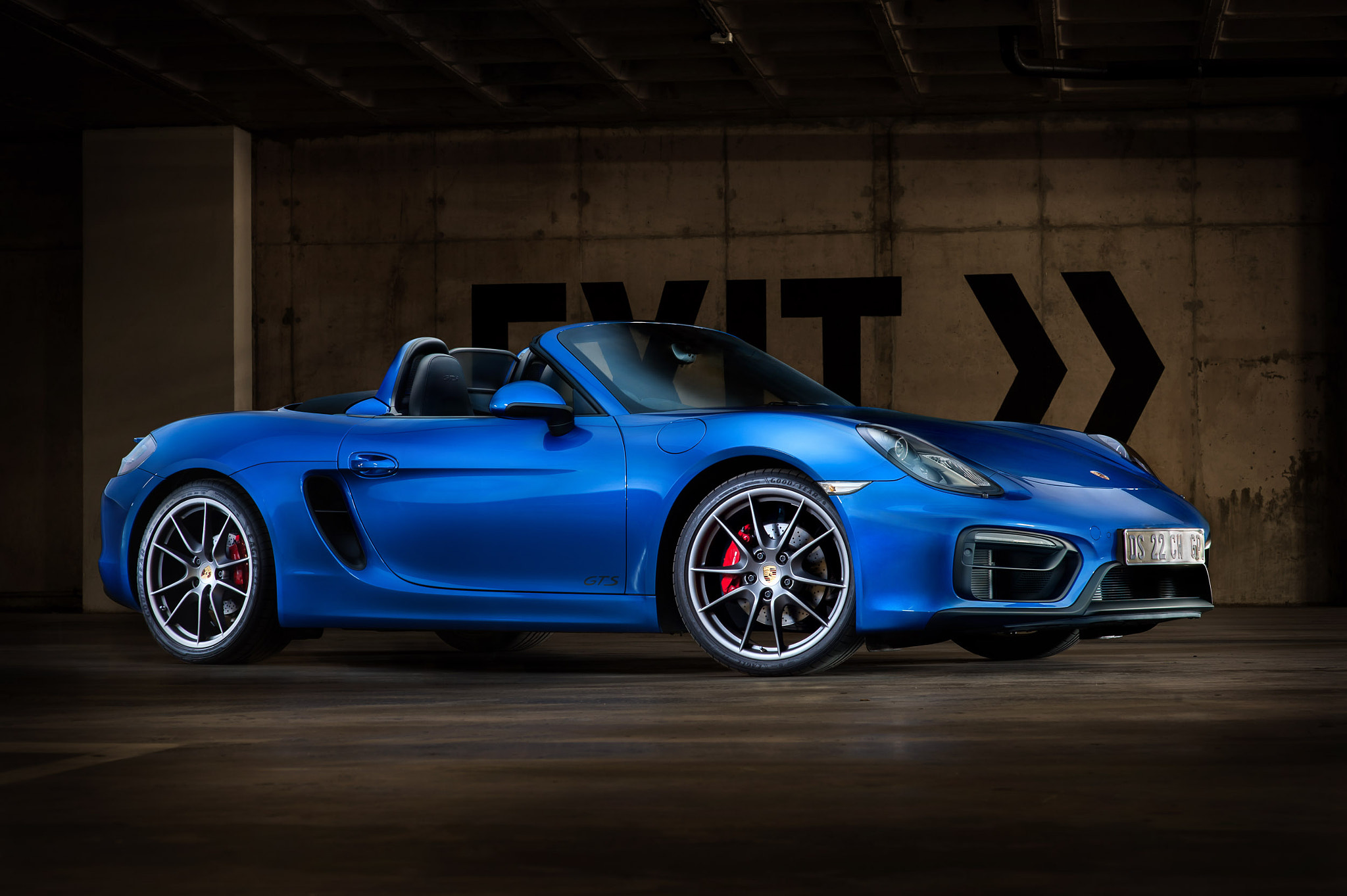 Blue Porsche Boxster side view