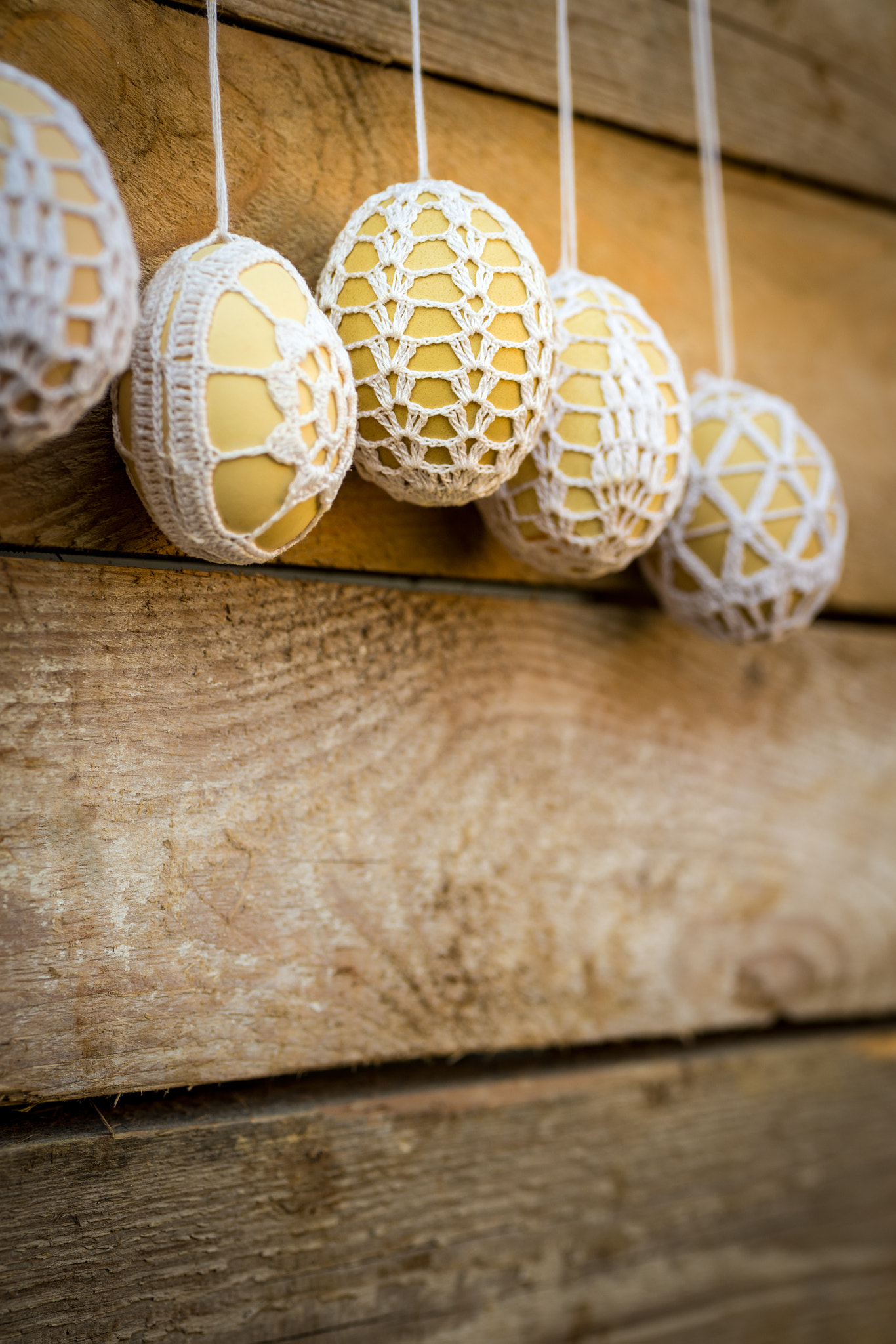 Sigma 70mm F2.8 EX DG Macro sample photo. Crochet pattern easter eggs on wooden background photography