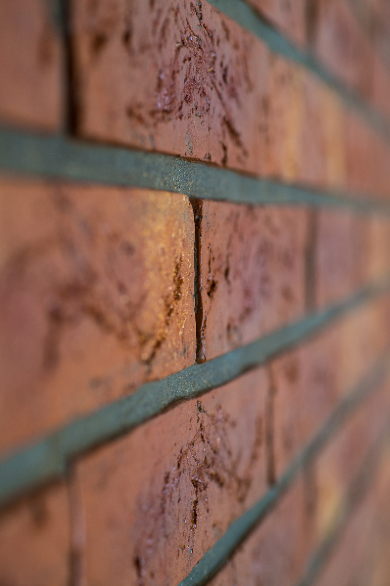 Nikon D4S + Sigma 70mm F2.8 EX DG Macro sample photo. Interior brick wall close up with shallow depth of field photography