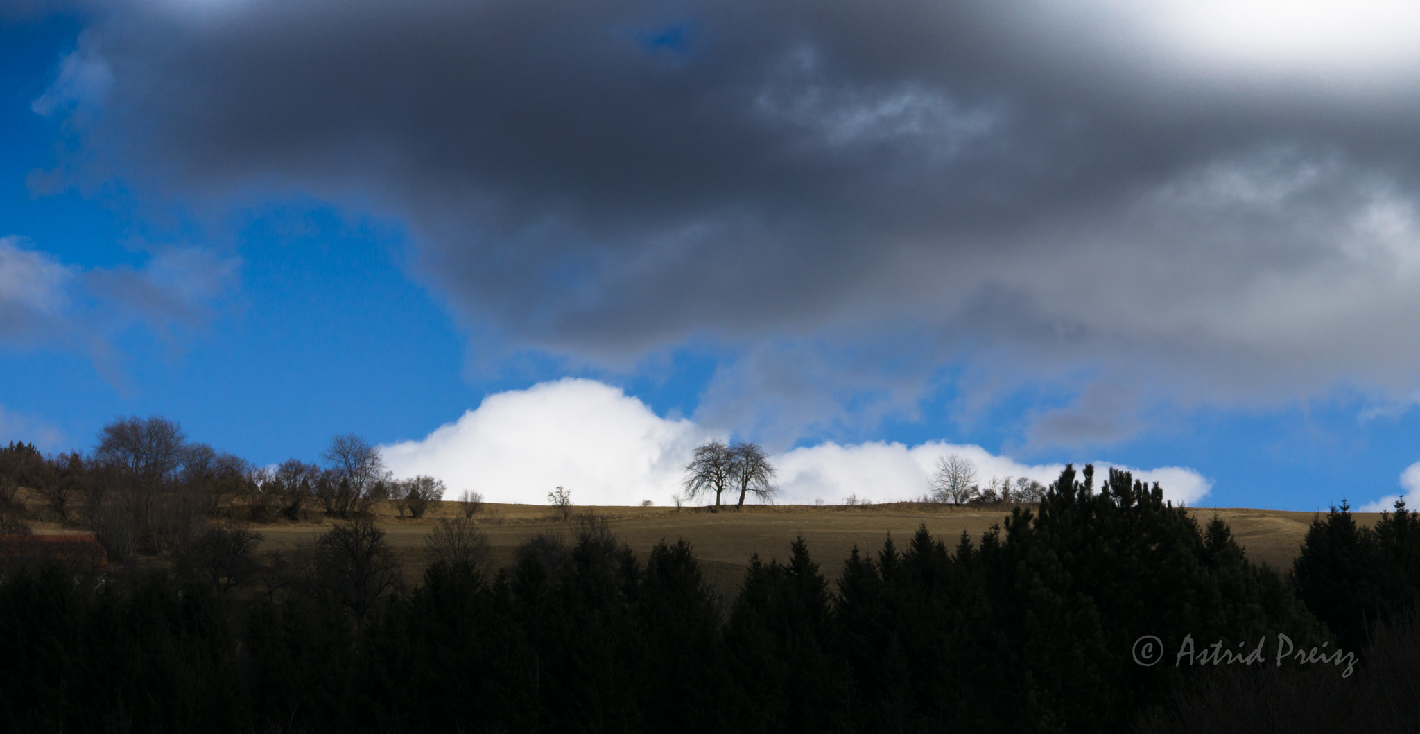 Sony FE 70-300mm F4.5-5.6 G OSS sample photo. Cloudy sky photography