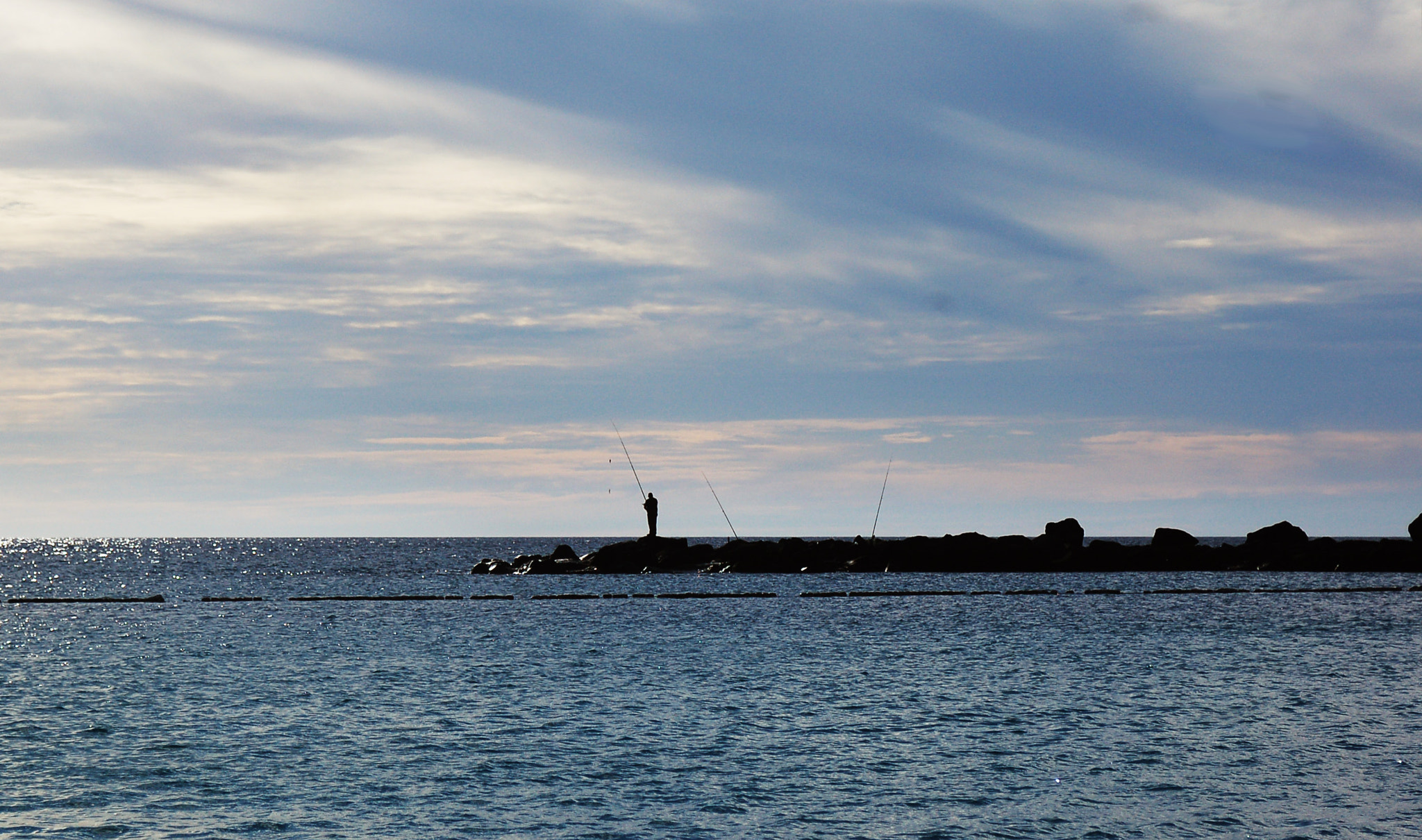 Nikon D50 + AF Zoom-Nikkor 28-85mm f/3.5-4.5 sample photo. Fisherman and the ocean photography