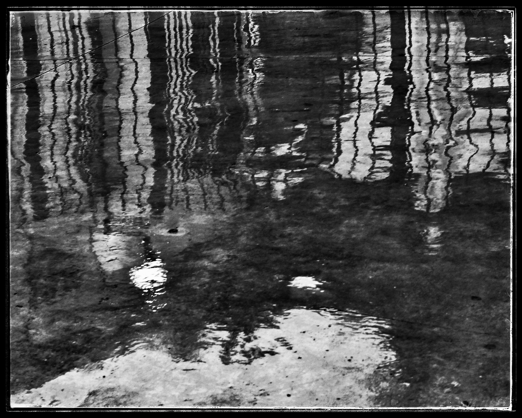 Canon EF-S 24mm F2.8 STM sample photo. Reflections on a wet floor photography