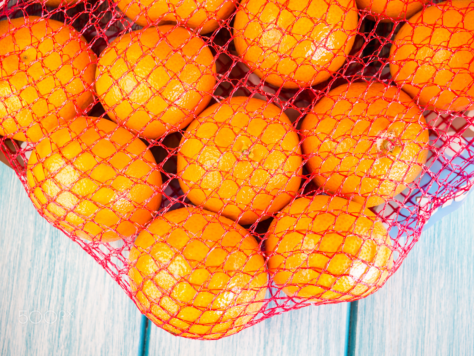 LUMIX G 20/F1.7 II sample photo. Tangerines in a net photography