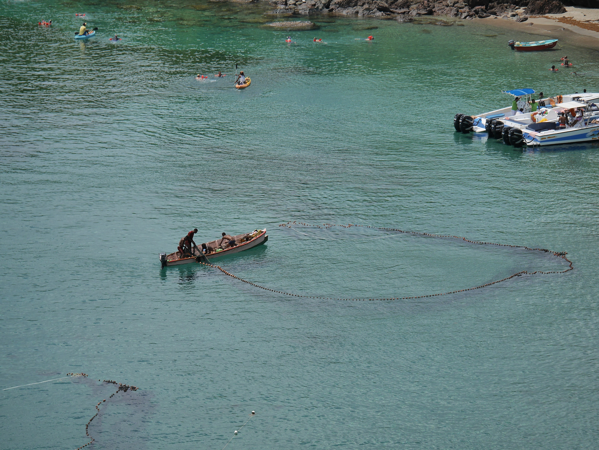 Panasonic Lumix G X Vario 35-100mm F2.8 OIS sample photo. Conflict between income fishing and tourism photography
