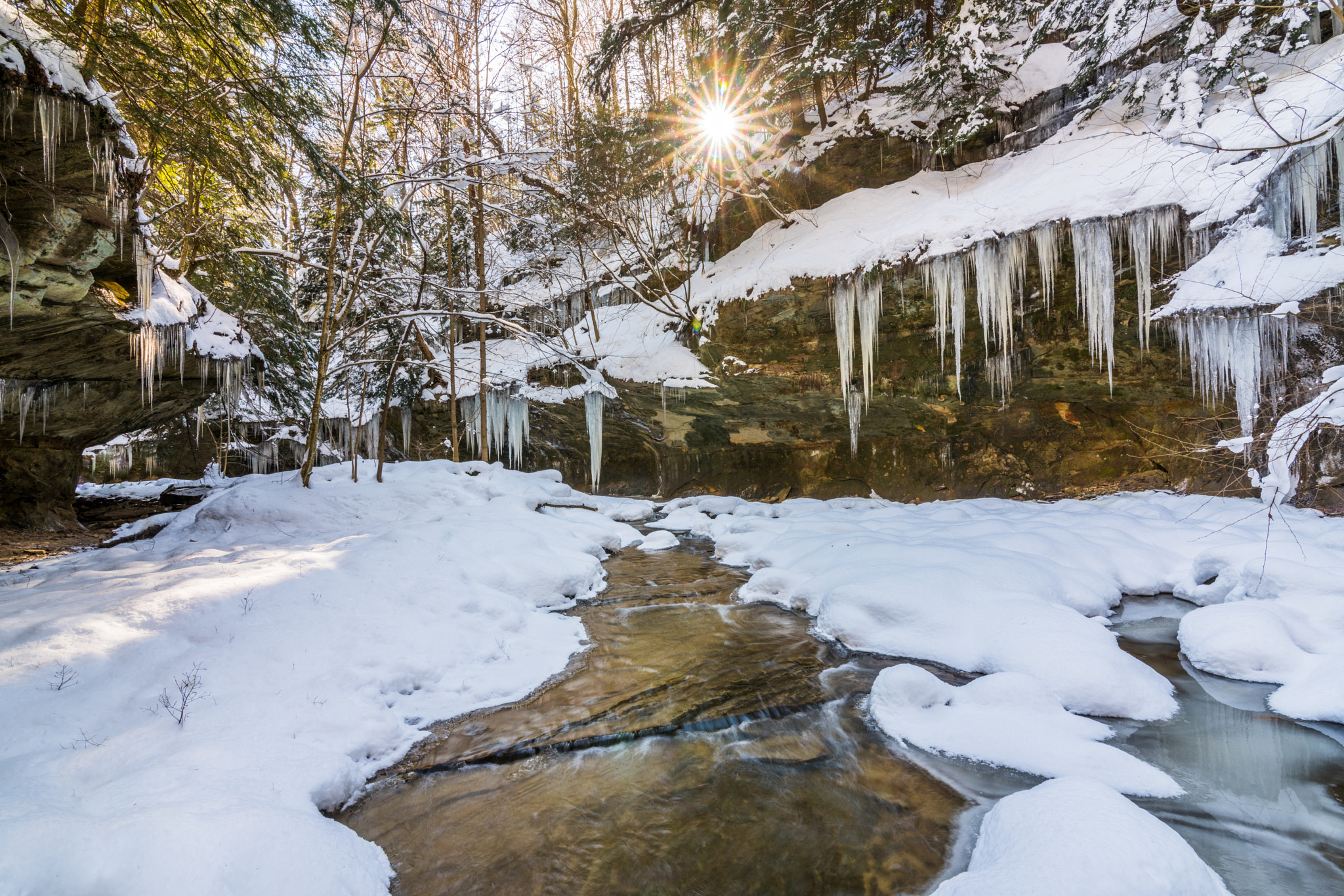 Nikon D810 + Tokina AT-X 16-28mm F2.8 Pro FX sample photo. Sunburst over icy river photography