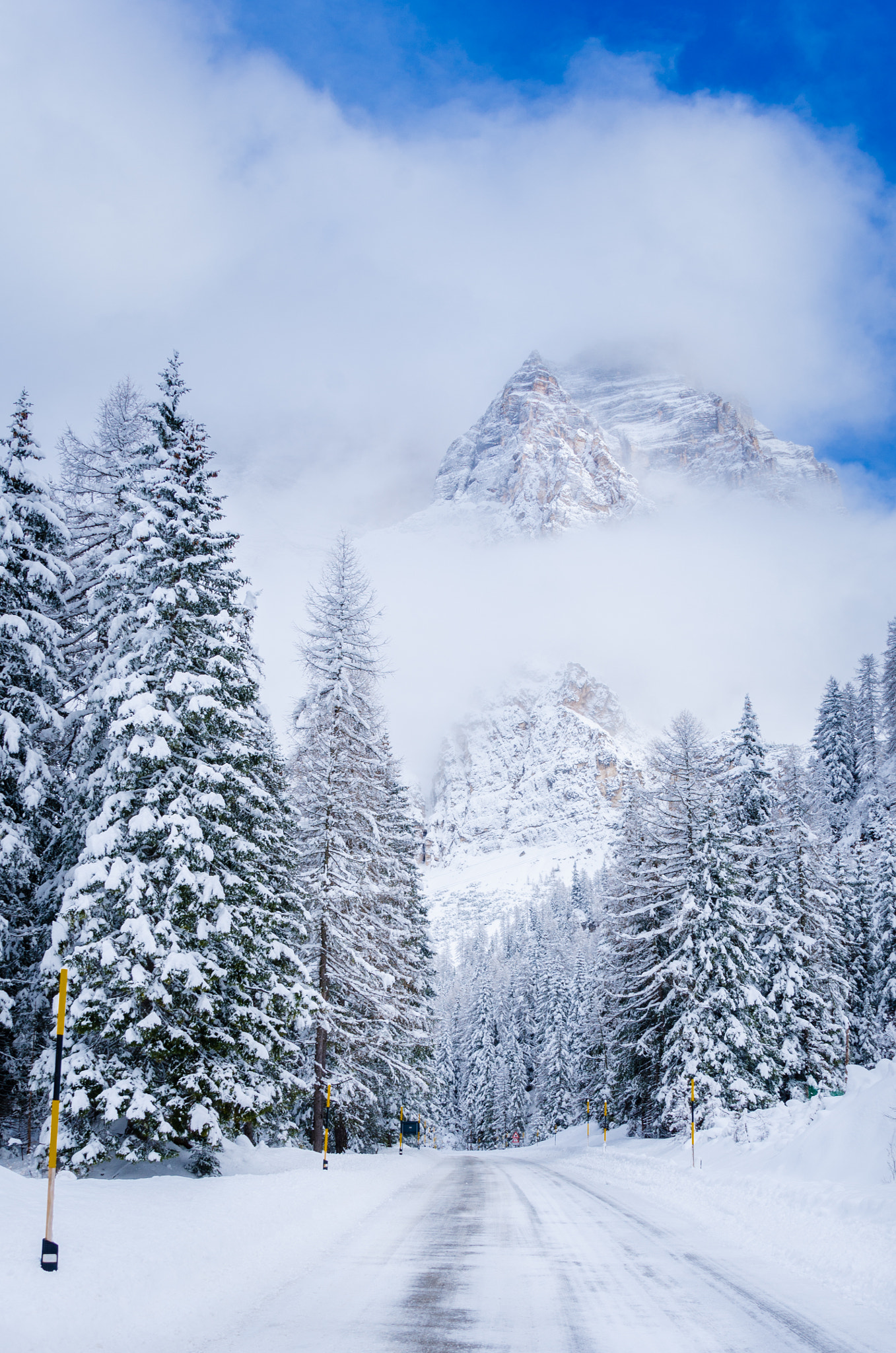 Nikon AF-S Nikkor 24-120mm F4G ED VR sample photo. Snowy mountain road photography