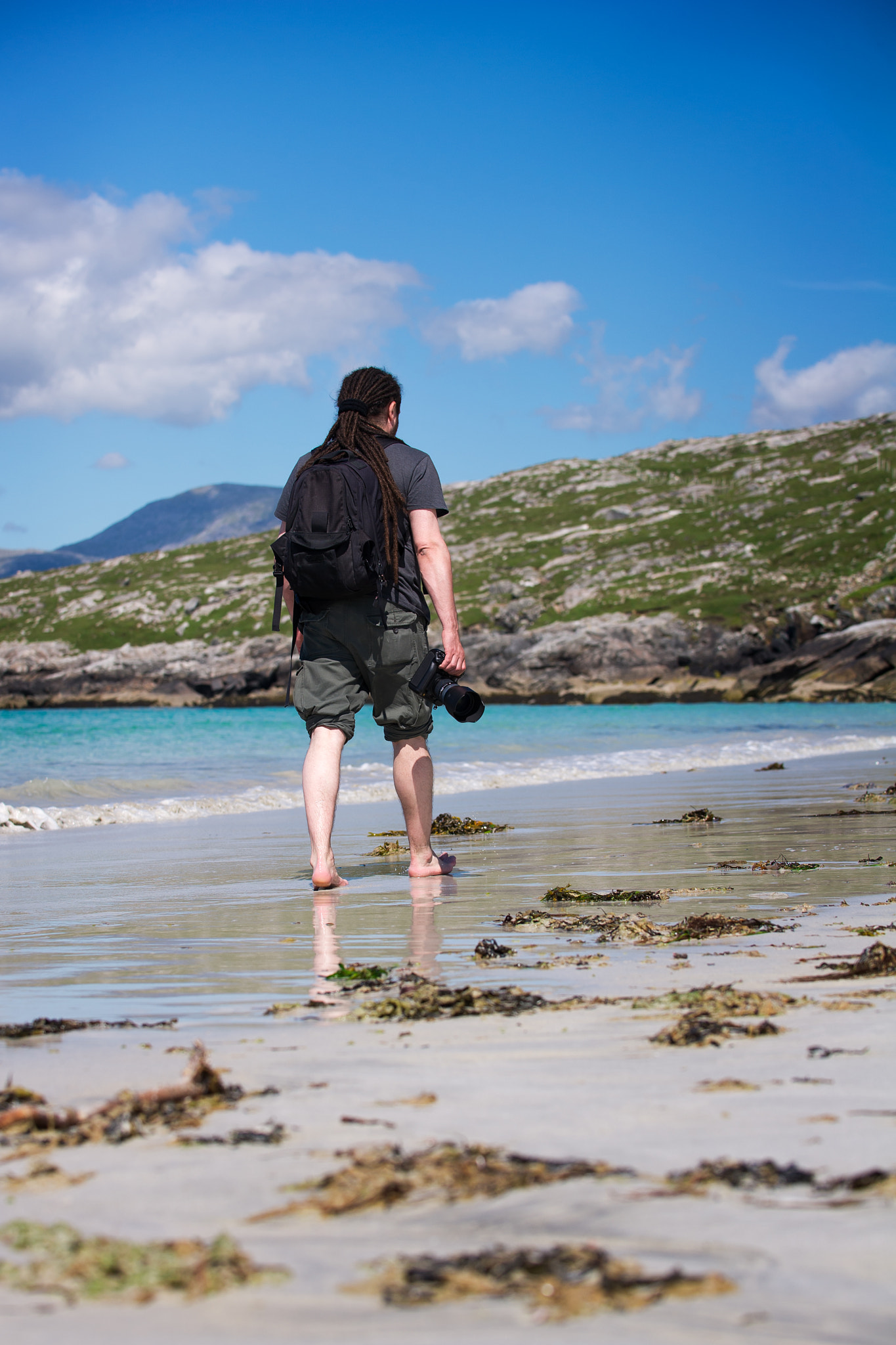 Nikon D3S sample photo. Young male photographer with dreadlocks at a sunny white sand be photography