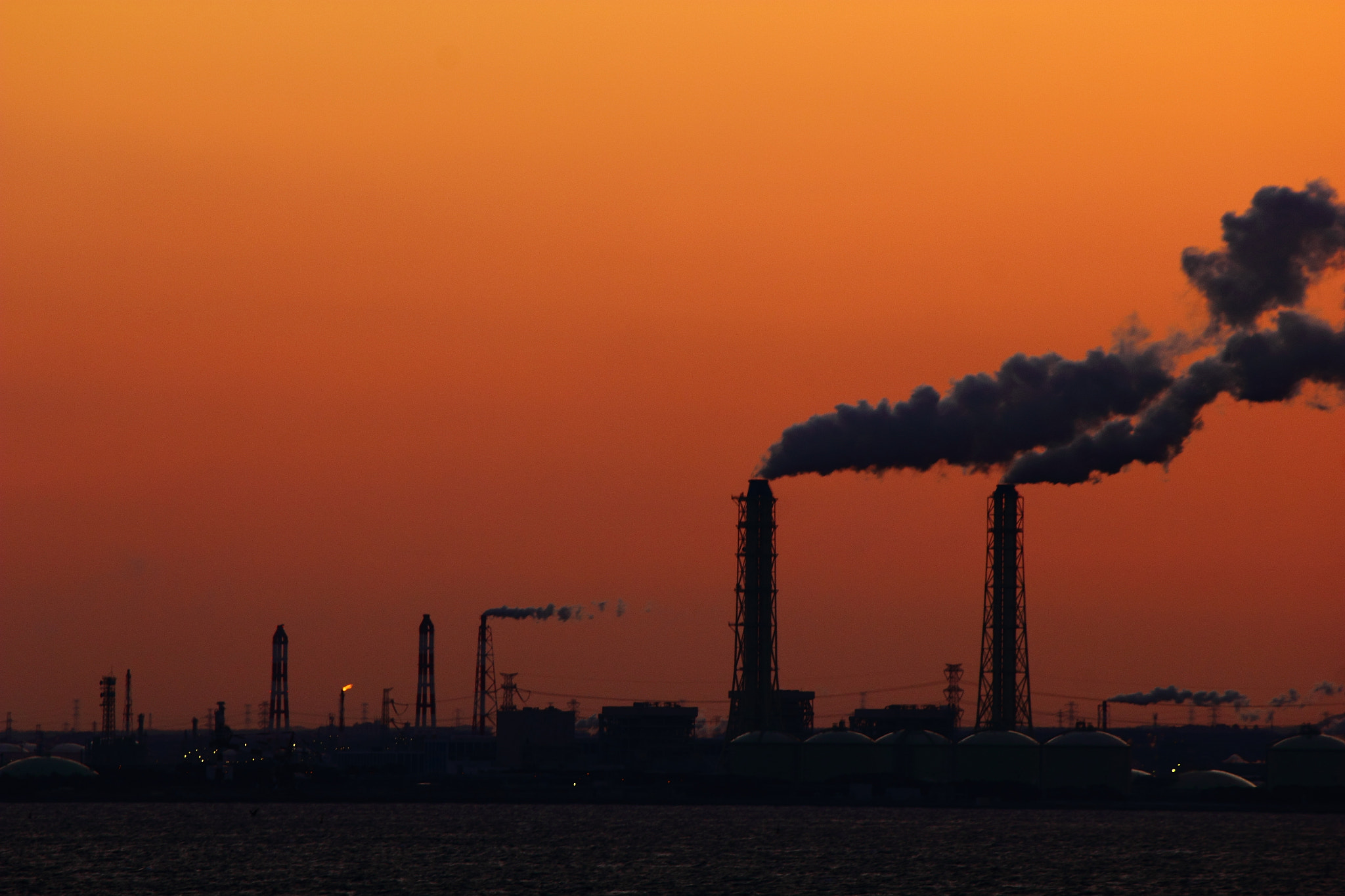 Canon EF-S 55-250mm F4-5.6 IS sample photo. Sunset with factories photography